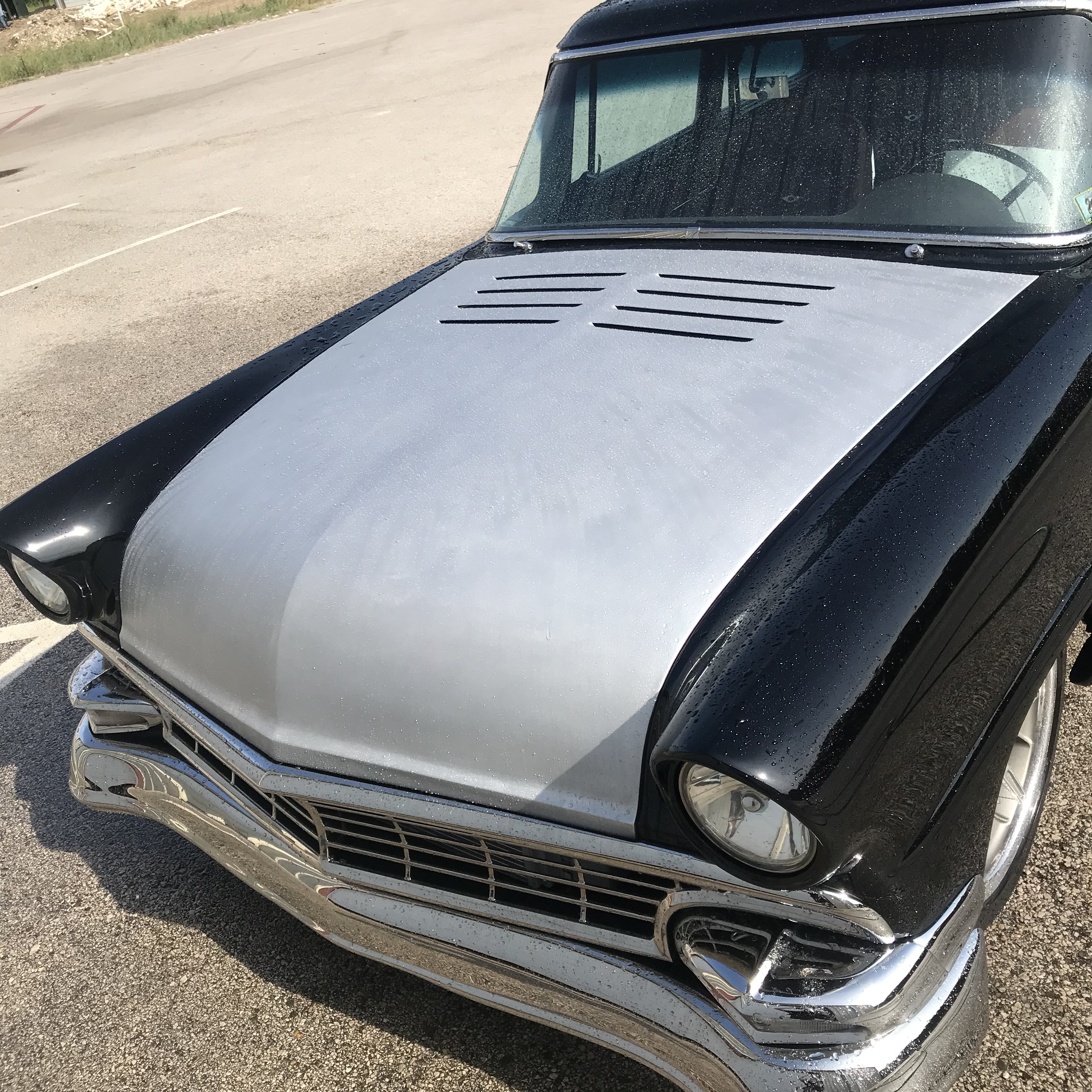 Hand-cut louvers set into the aluminum skin at the cowl.