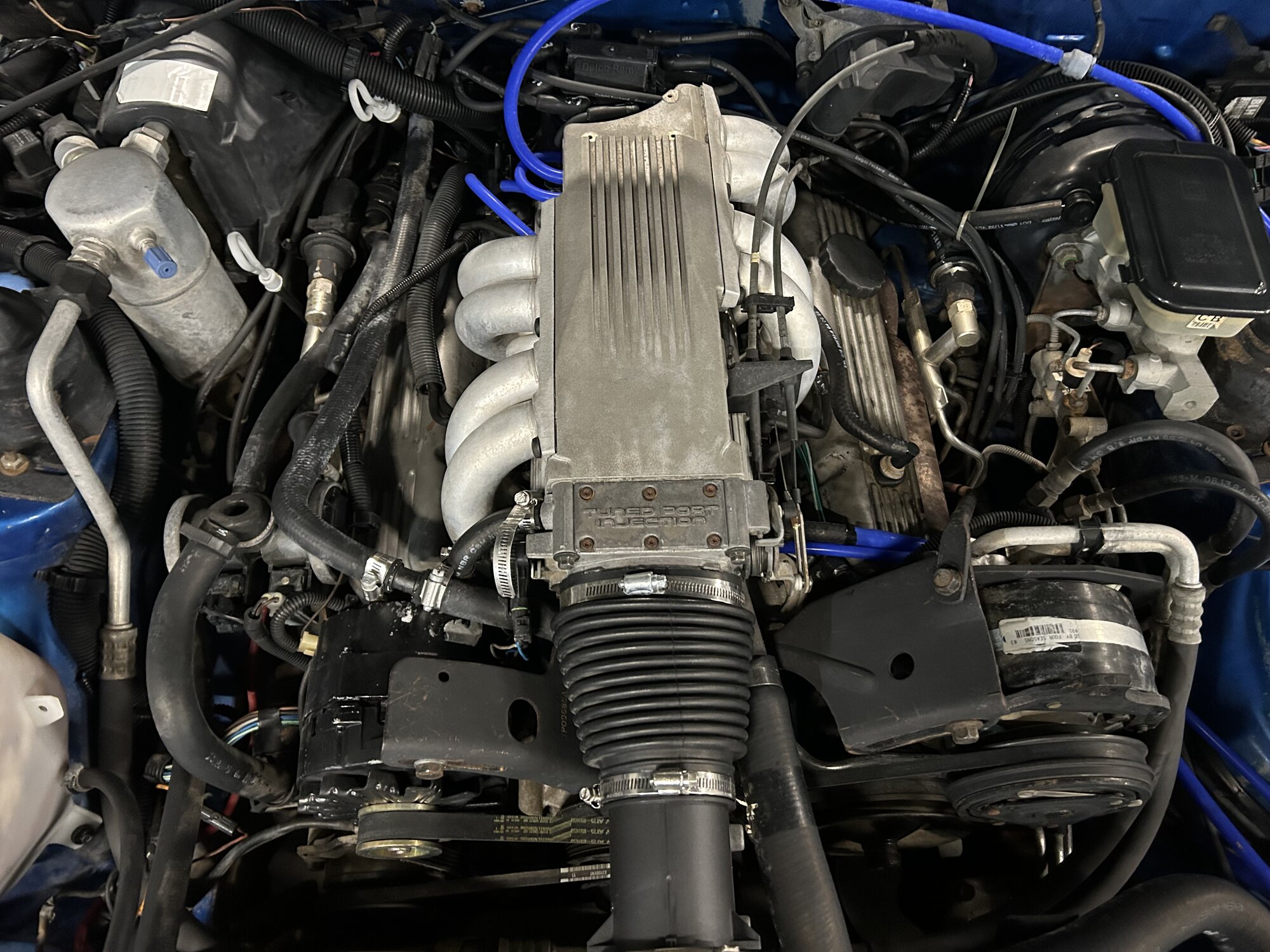 The Tuned Port Injection plenum. The vacuum leak hiding in here is what the seller diagnosed as overheating.