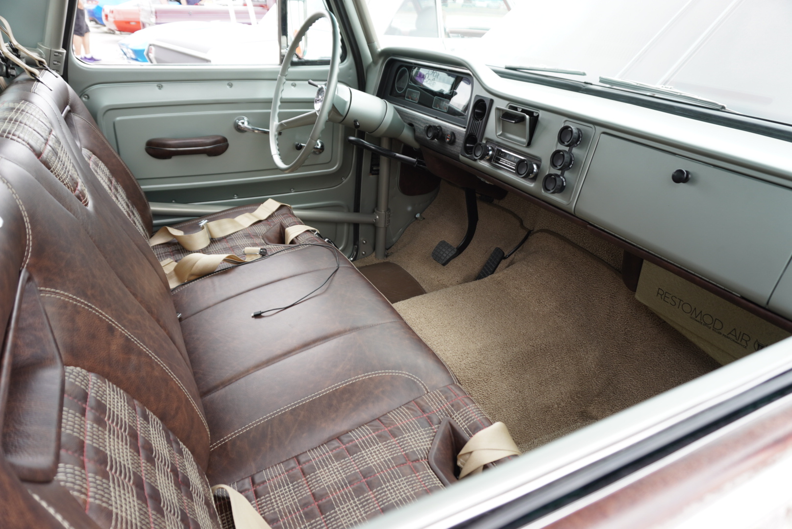 Interior from the passenger side — custom leather bench by Jay Schluter with Levi Green design cues.
