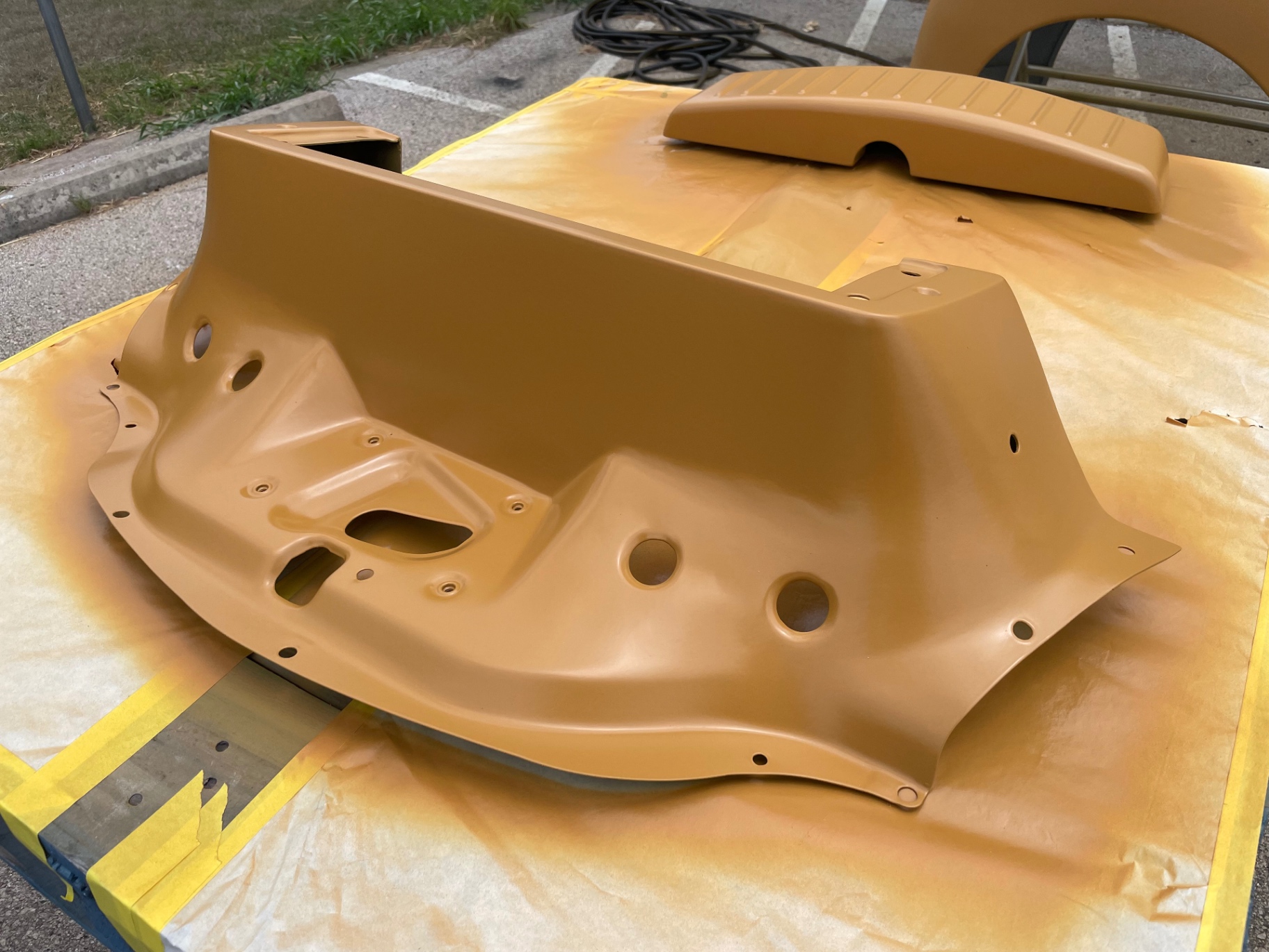 Firewall and radiator cap panel laid flat for even coverage.