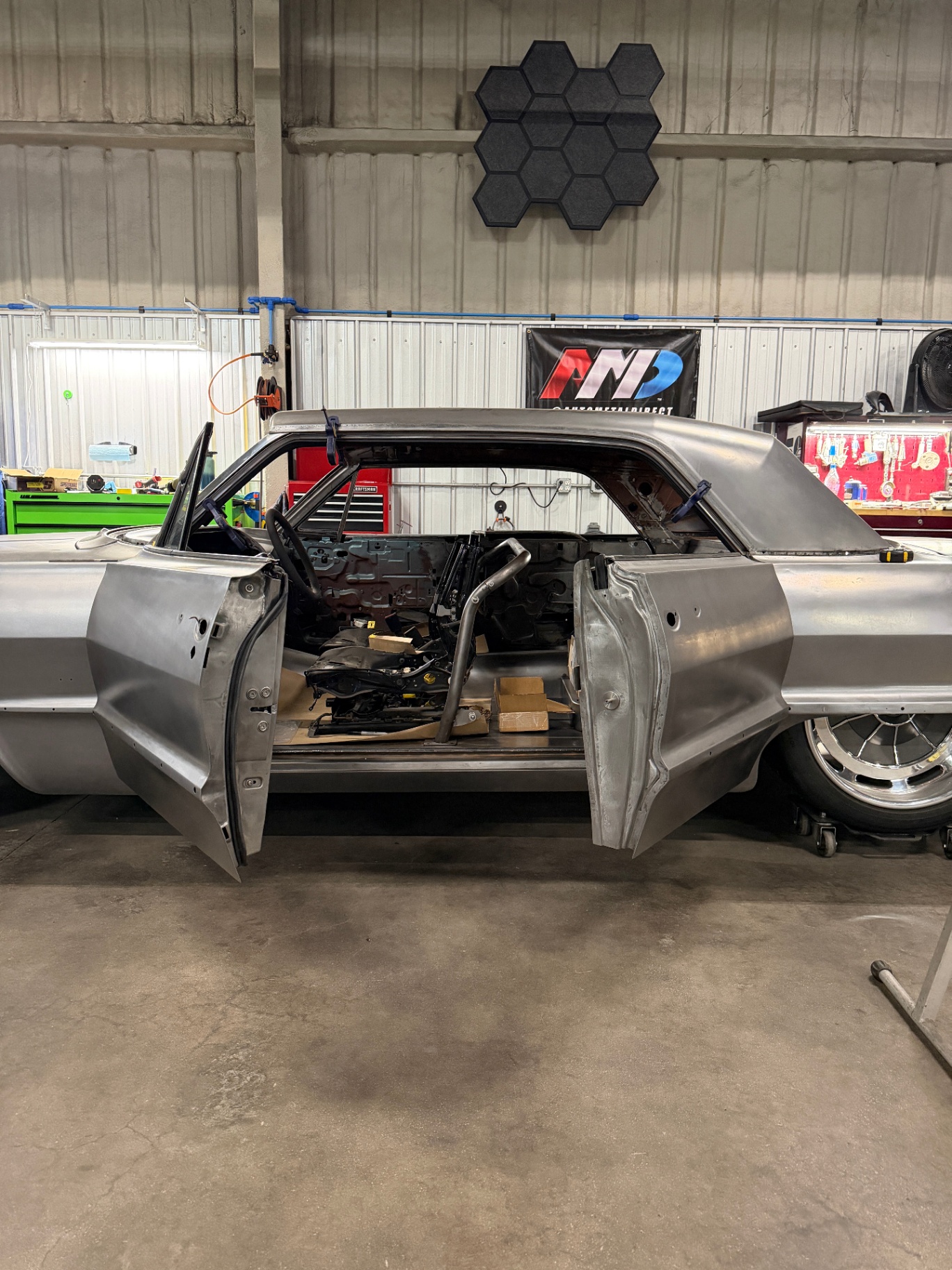 Body on the rotisserie with the reworked suicide doors hung and swung open.