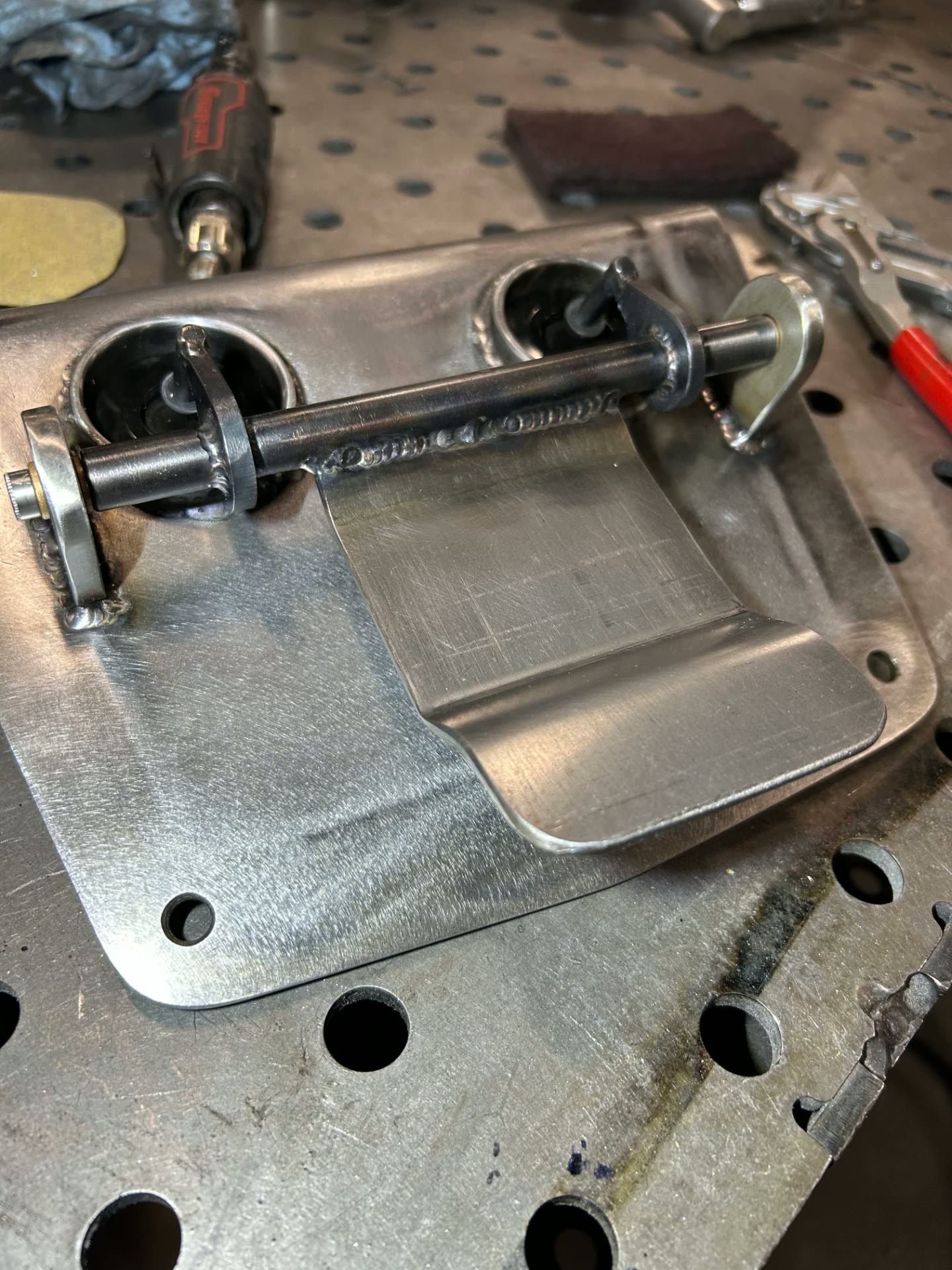 Welded latch and pivot assembly built for the panel.