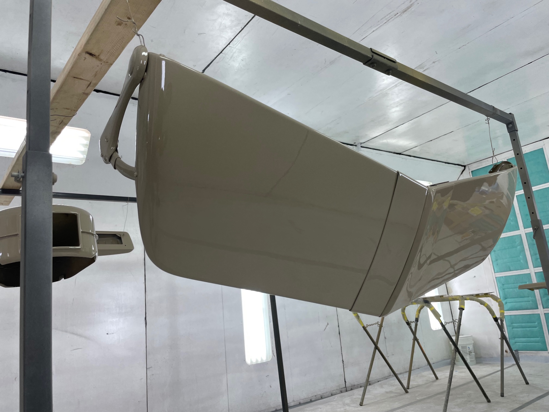 Cab quarter and rear panel hung on the rack after clear.