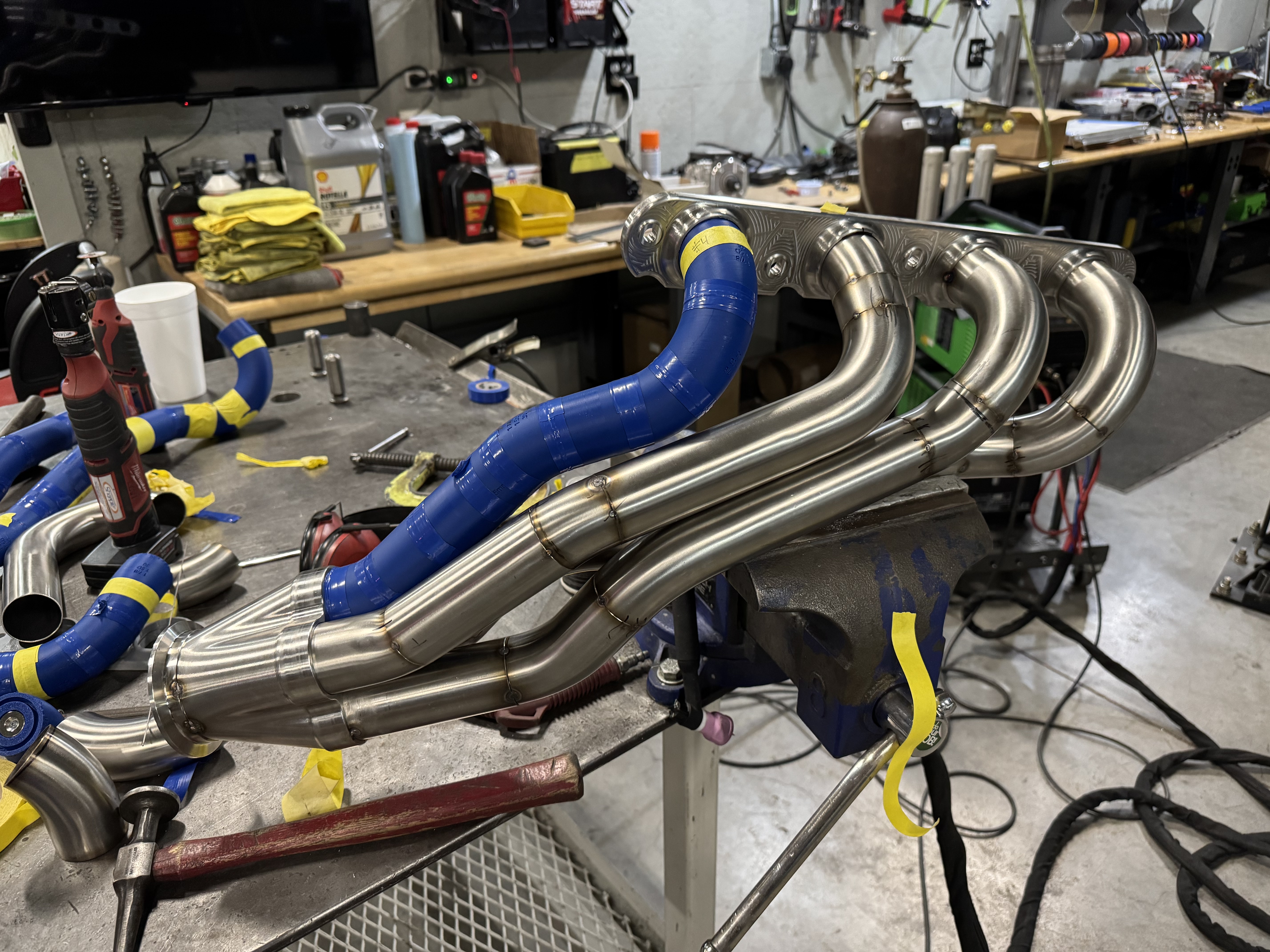 On the bench with SSCustoms 3D printed build blocks used to iterate and visualize the tube layout.