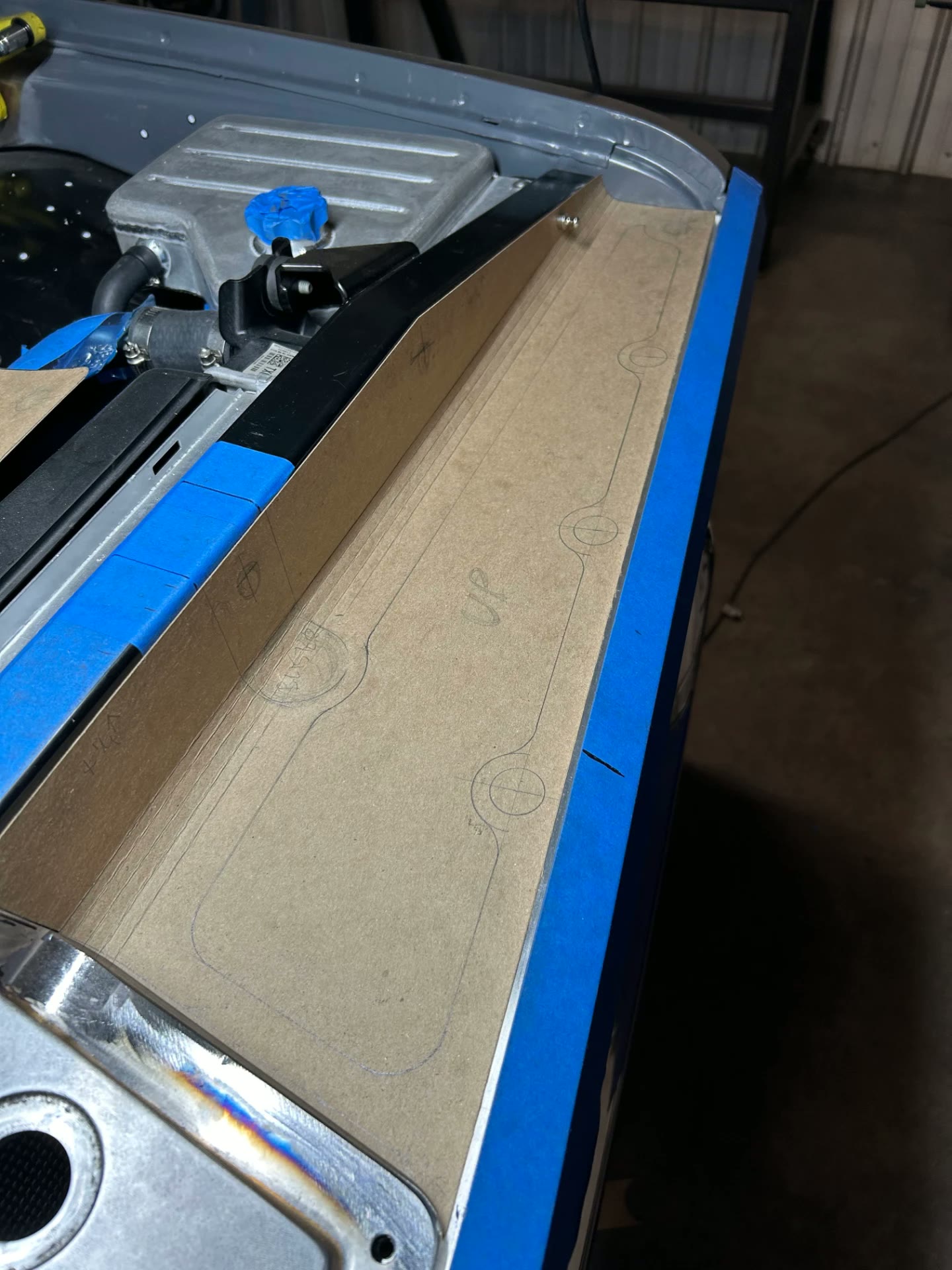 Paper template laid out on the truck to set the panel shape.