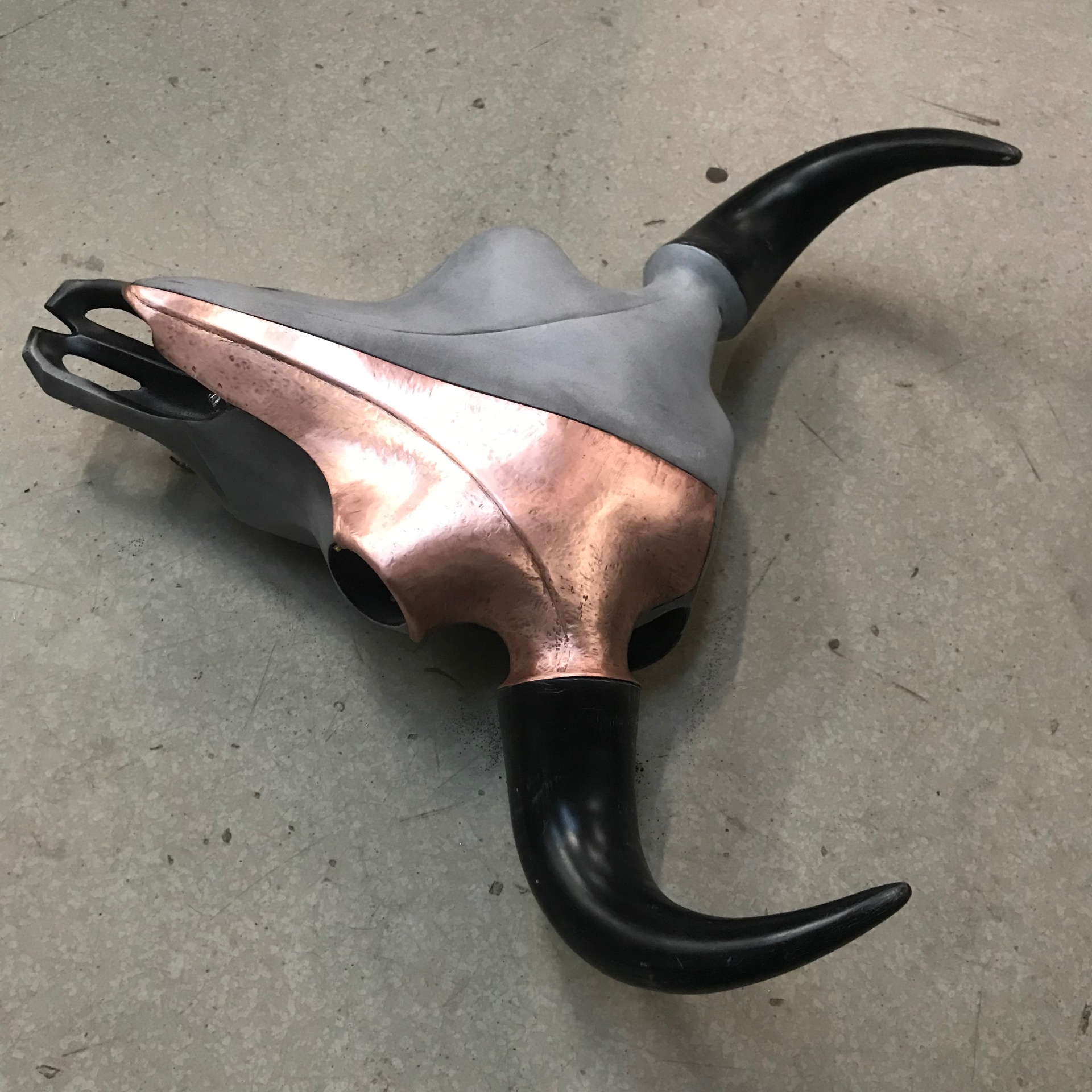 Side profile — copper wraps from crown to nose.
