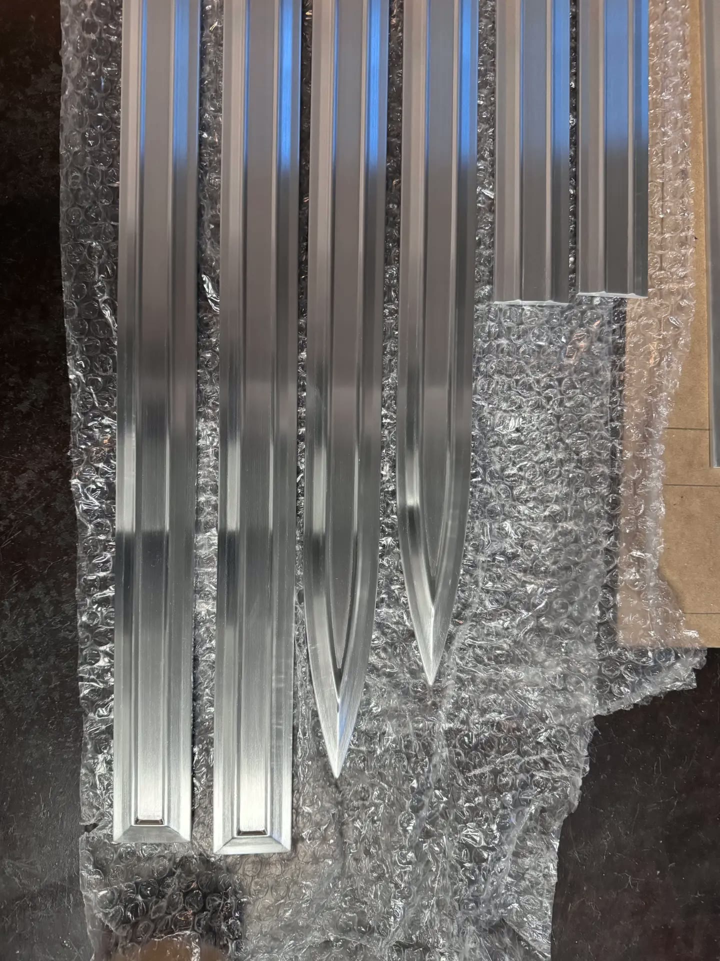 Machined billet trim pieces as they arrived from the shop.