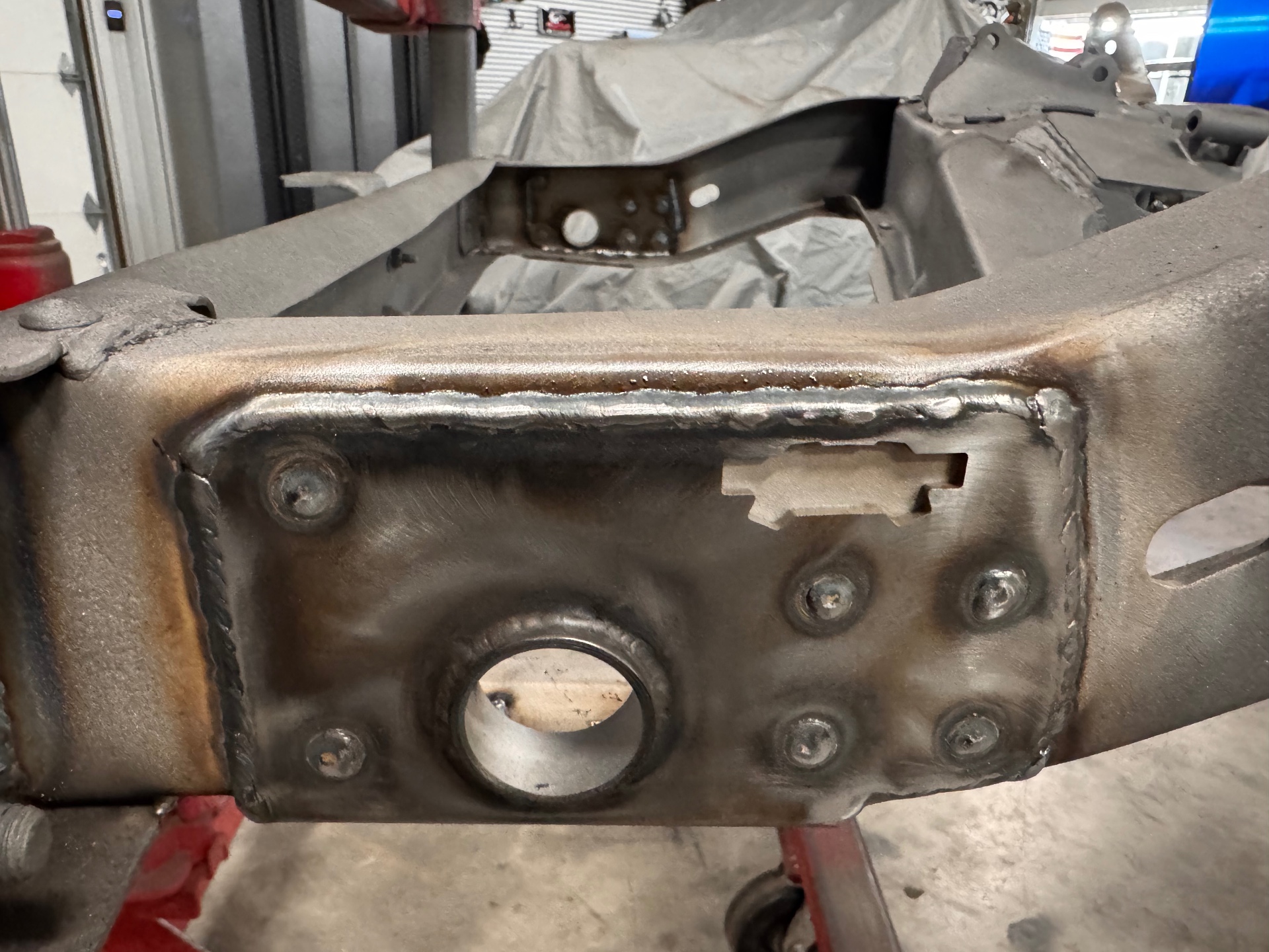 New front sway bar brackets welded in instead of bolted in. Designed to fit the 1-1/4" solid splined sway bar and clear the new Johnson's radiator. Plates get welded on the inside and outside of each frame rail.