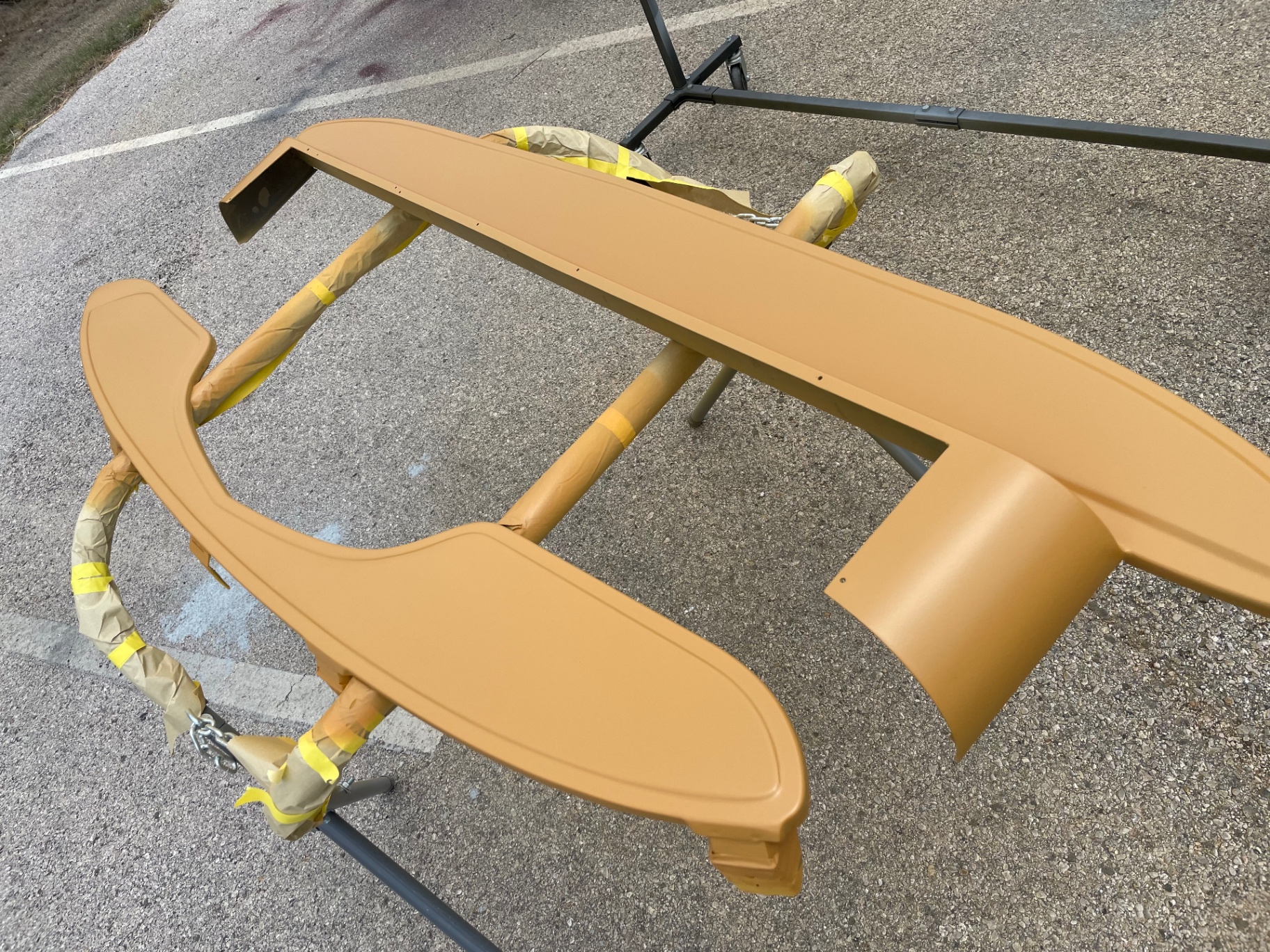 Front fender inner structure and skirts — every hidden surface primered too.