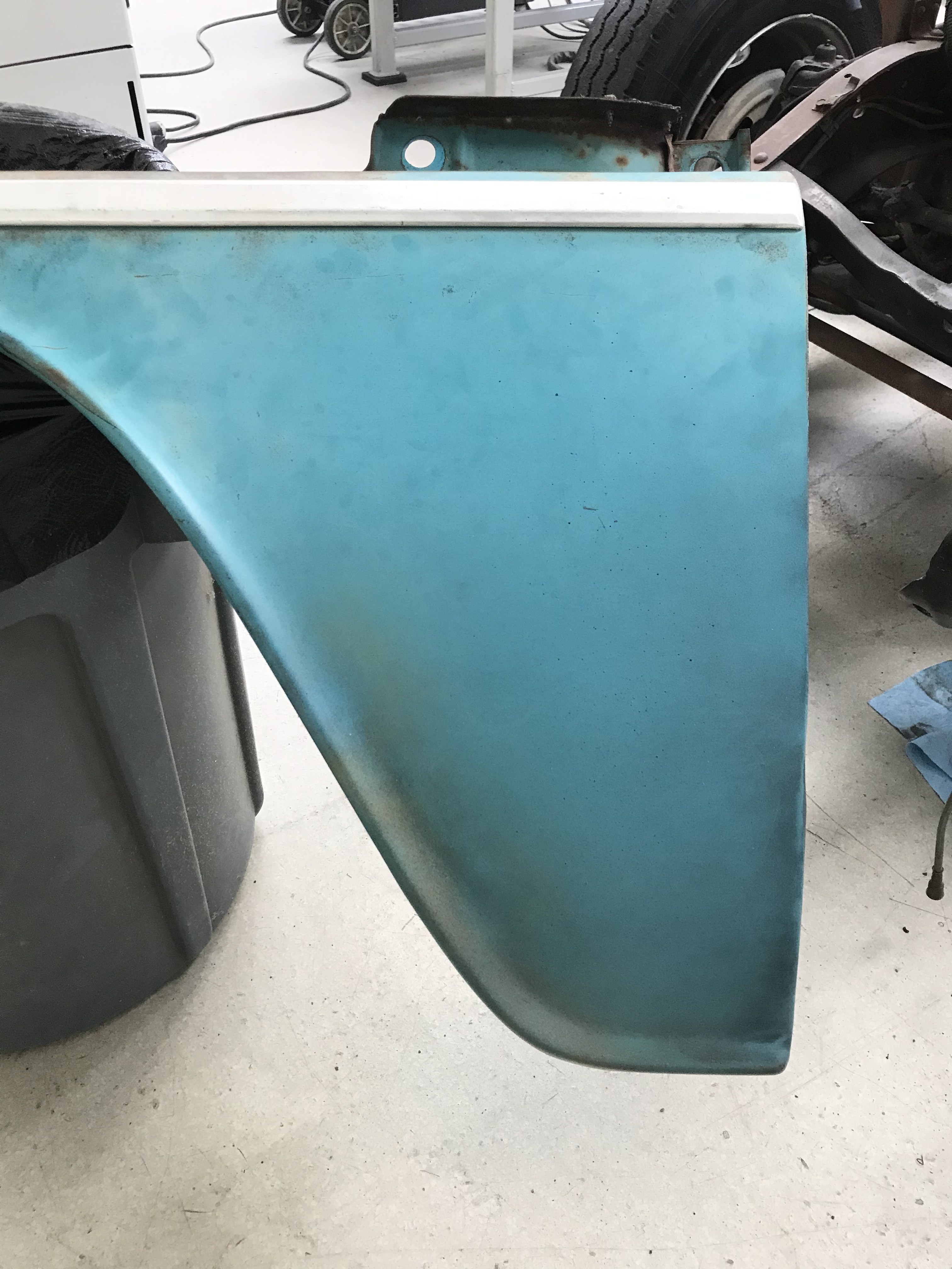 Cab quarter with hand-blended patina — the goal isn't fake wear, it's a seamless match to the panels that came in on the truck.