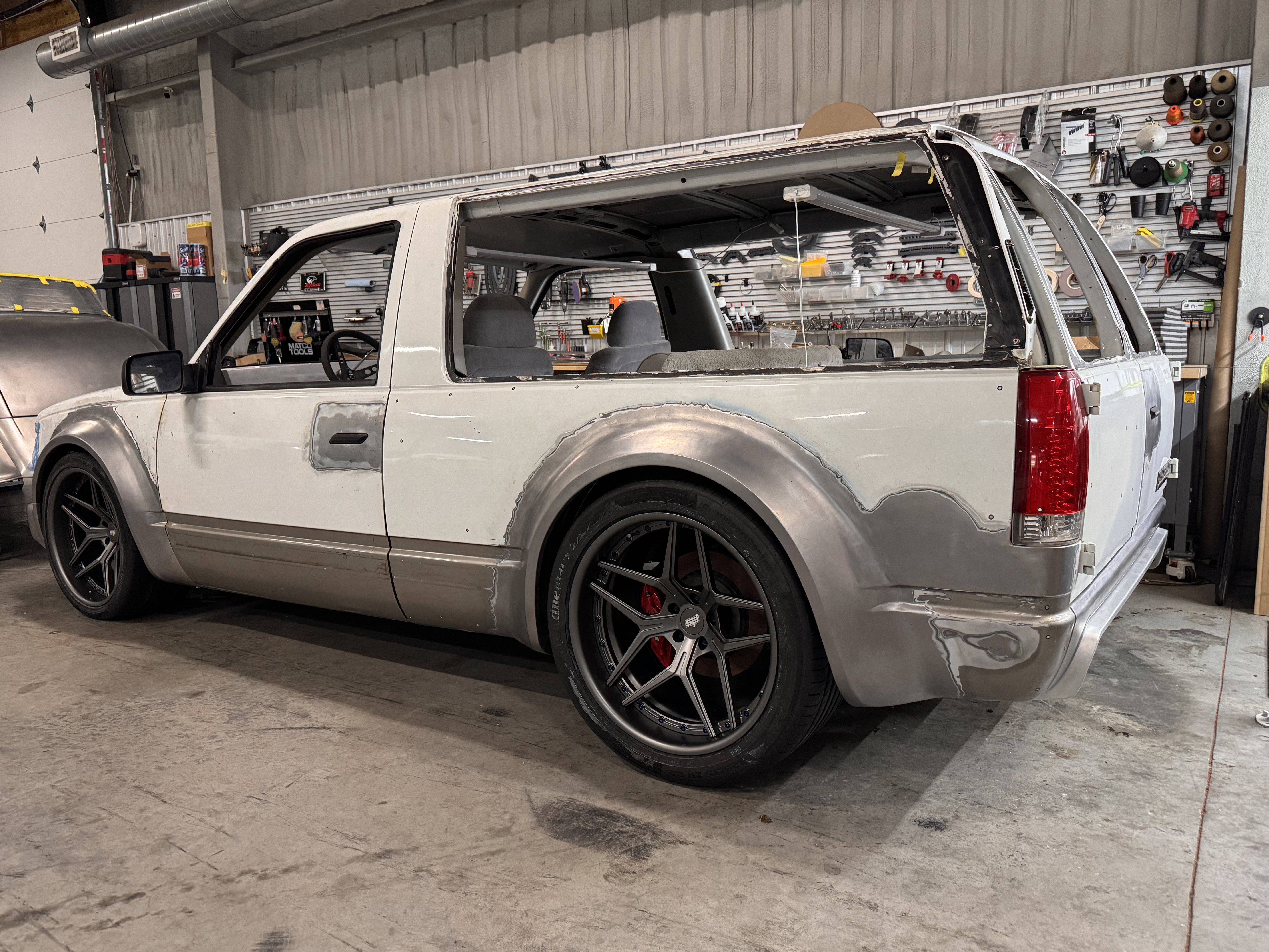 Driver side — stance dialed in now that the real wheels are on.