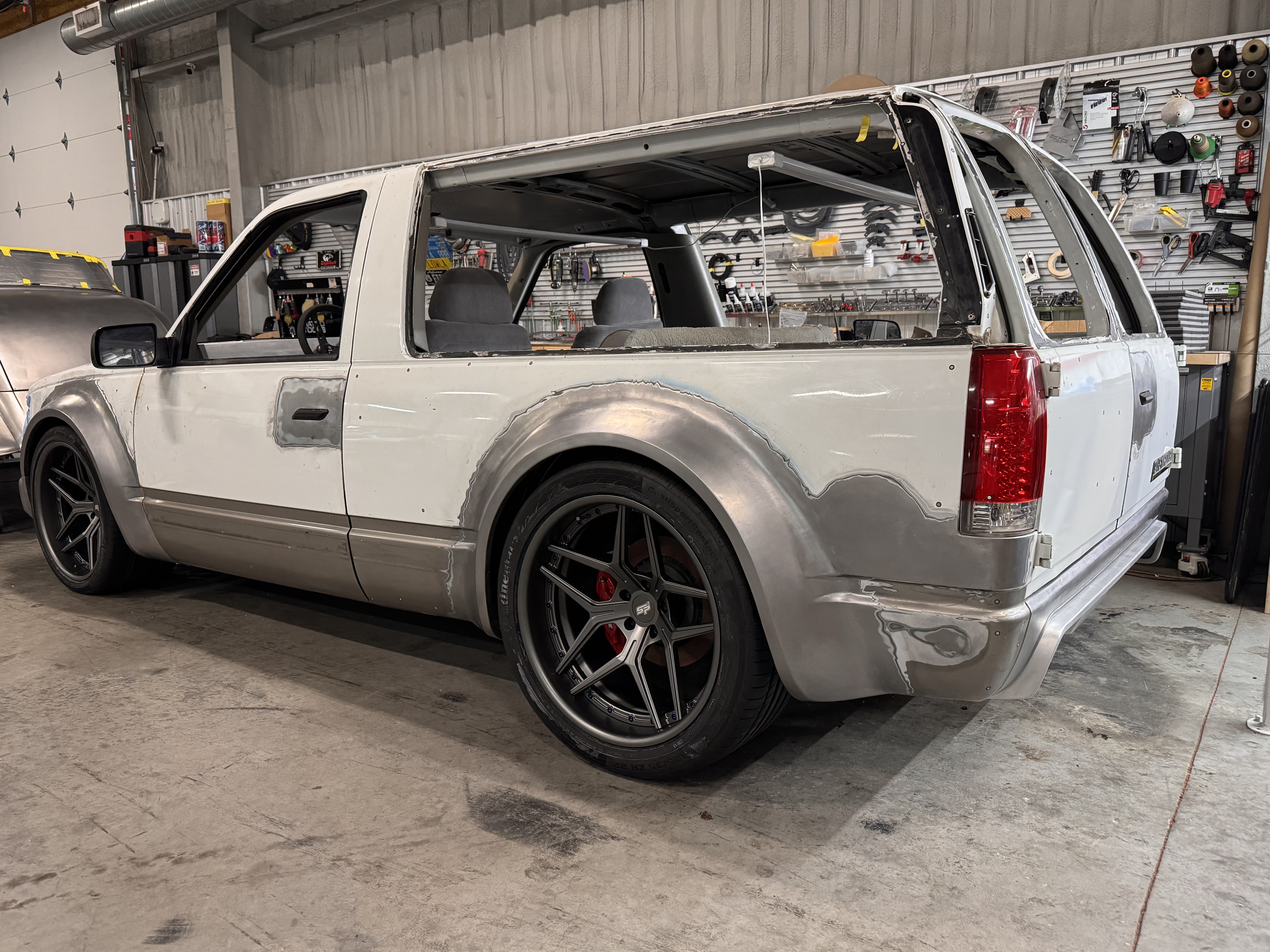 Rear three-quarter with the SP2s tucked under the widened quarters.