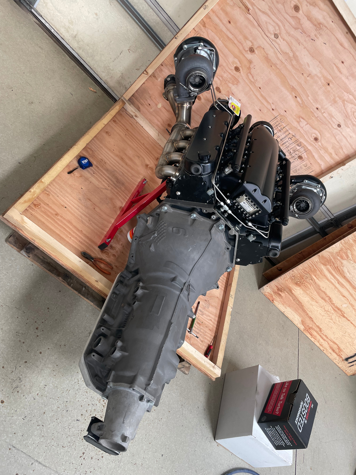 The Nelson Racing twin-turbo V8 and transmission on the crate the day it landed at the shop.
