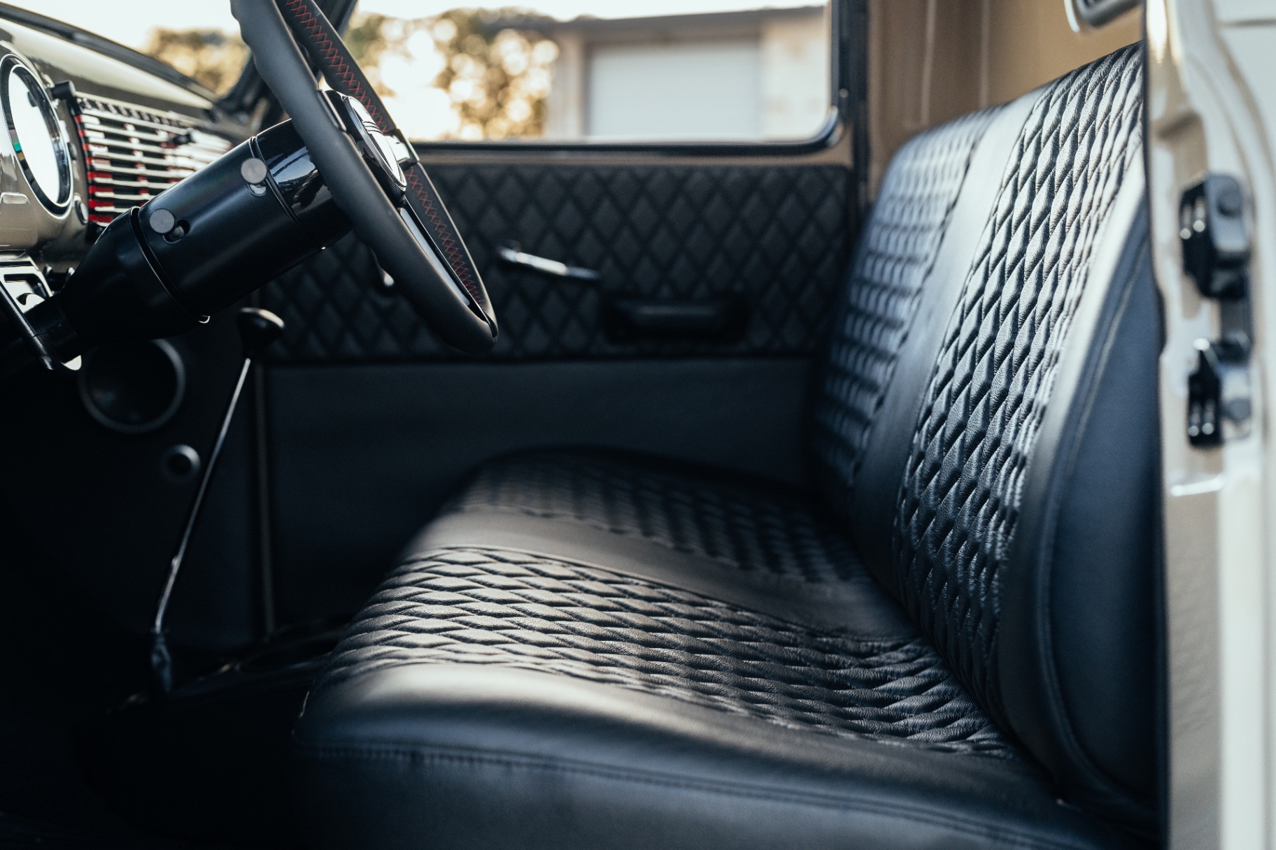 Bench and door panel — phase 1 diamond stitch, later revisited on the doors.