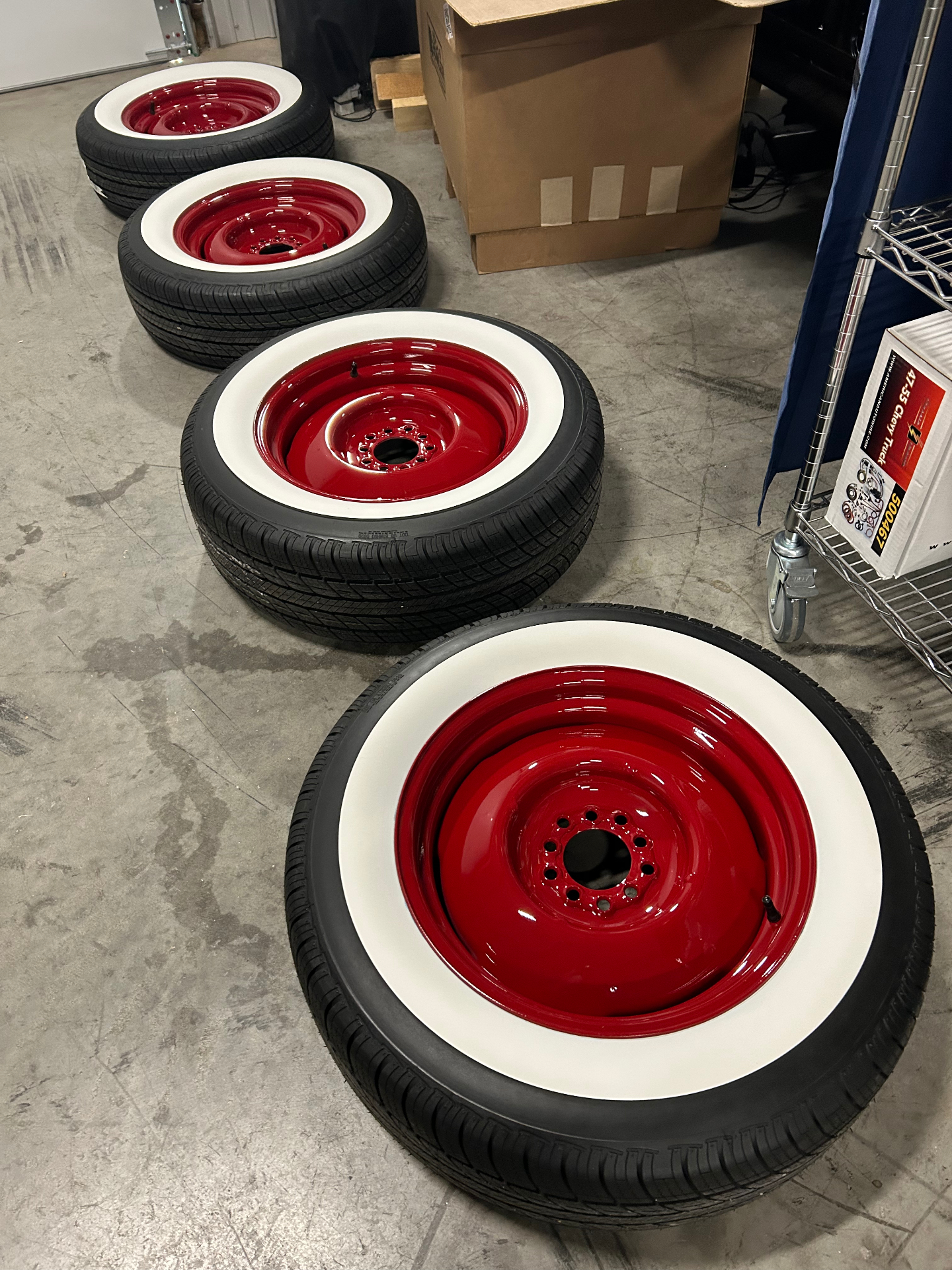 Coker steelies powder coated body-matched red, mounted up with Diamondback Classics wide whitewalls.