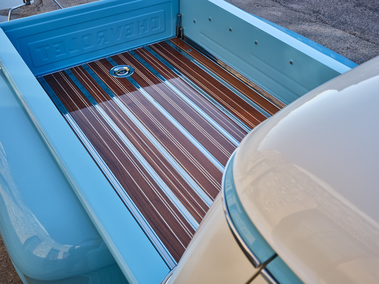 Tailgate-down view of the finished bed — Chevrolet-stamped tailgate and satin clear-coated blue interior.
