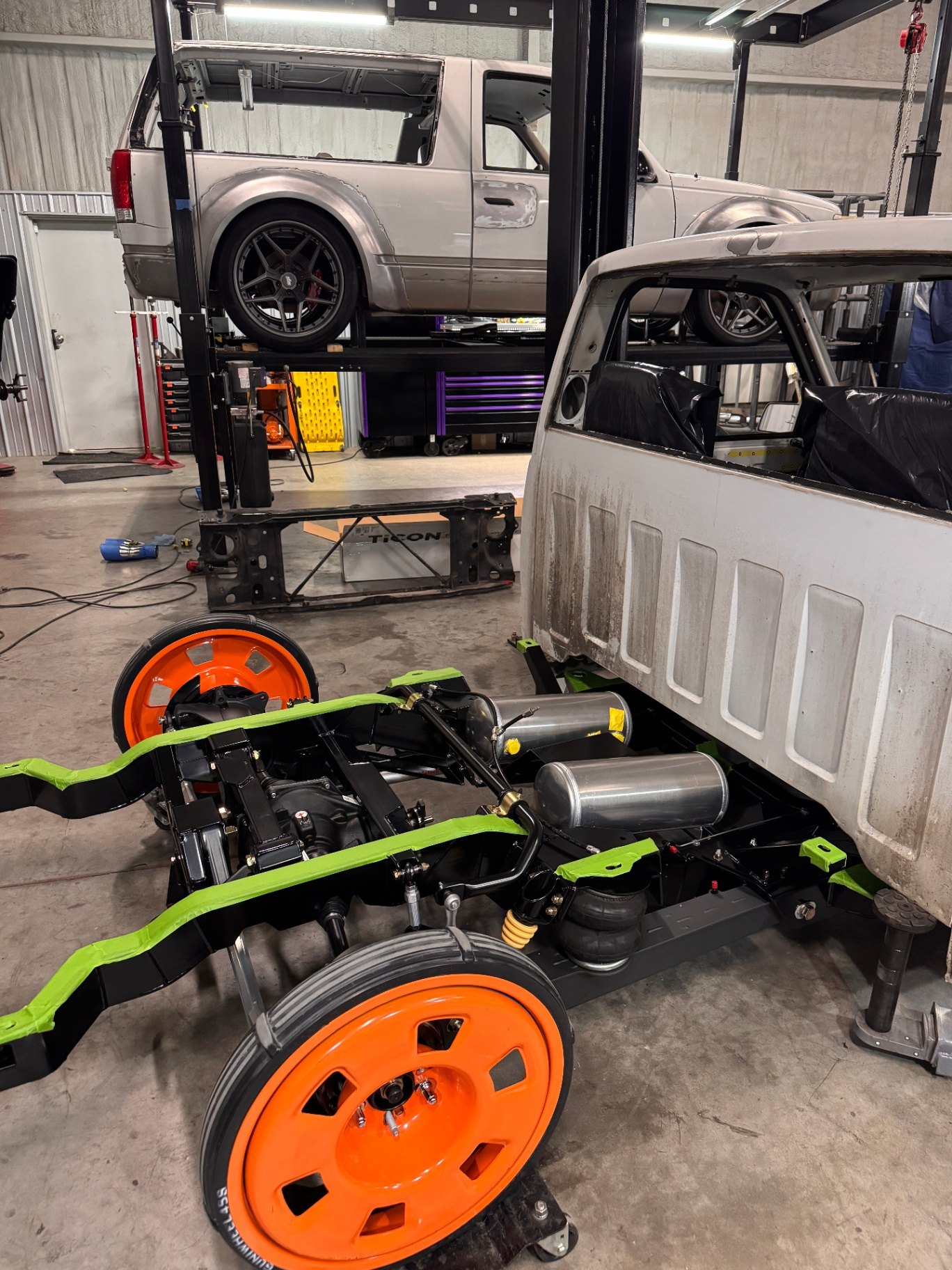 Rear suspension detail — air tanks mounted and ready for lines.