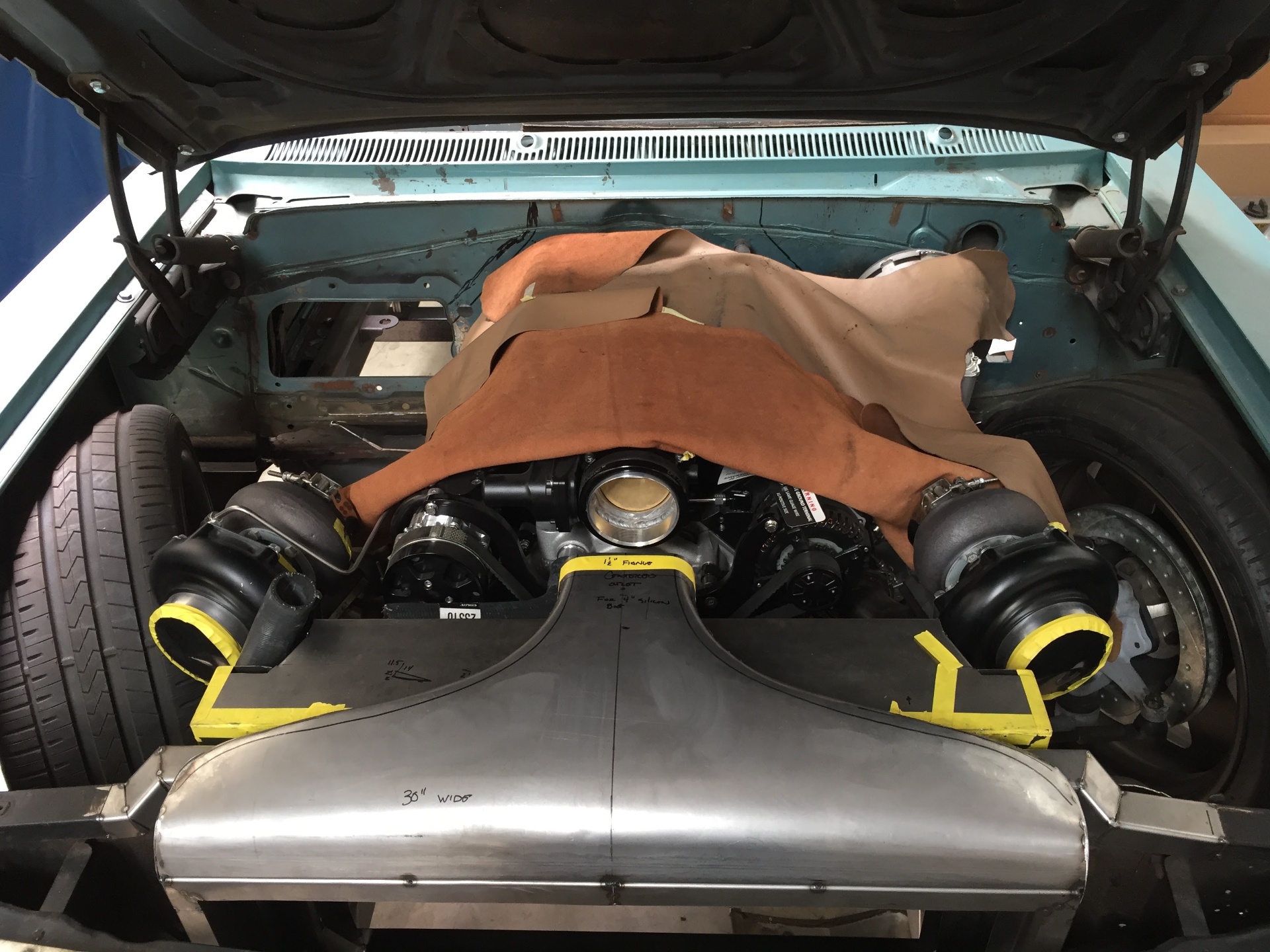 Front-on view of the mockup — twin Nelson turbos flanking the plenum blank, intercooler blank across the front.