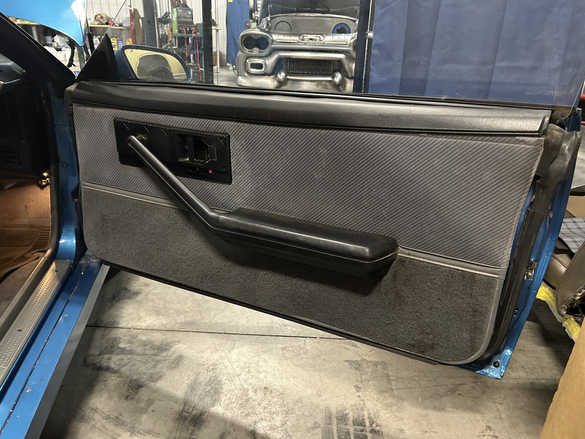Original door panel with the power window switches still working.