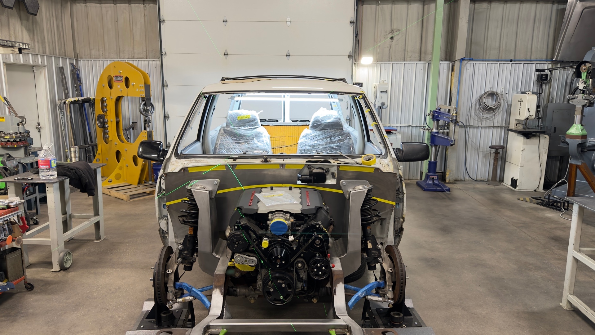 Body mocked on the chassis with LT1 in place — laser alignment for panel gaps.