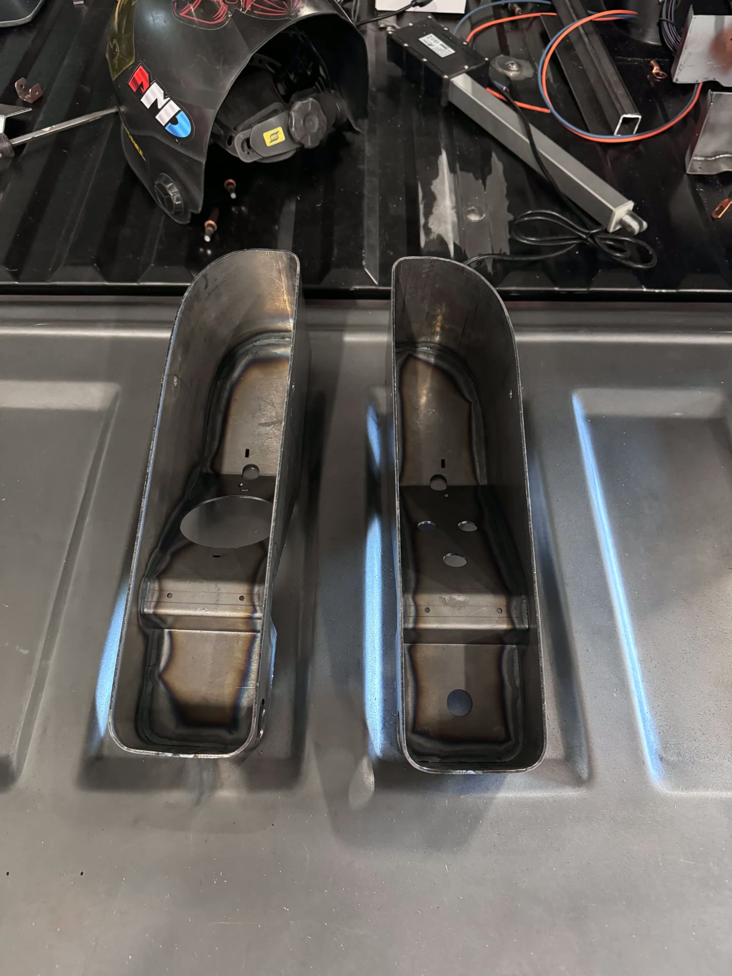 Tail light housings fabricated and drilled for the light hardware.