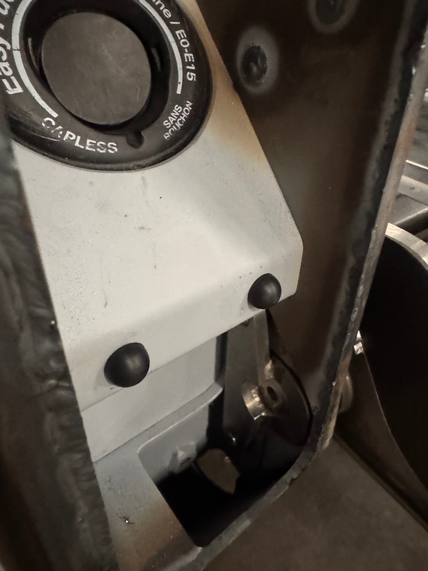 Capless fuel filler mounted behind the panel.