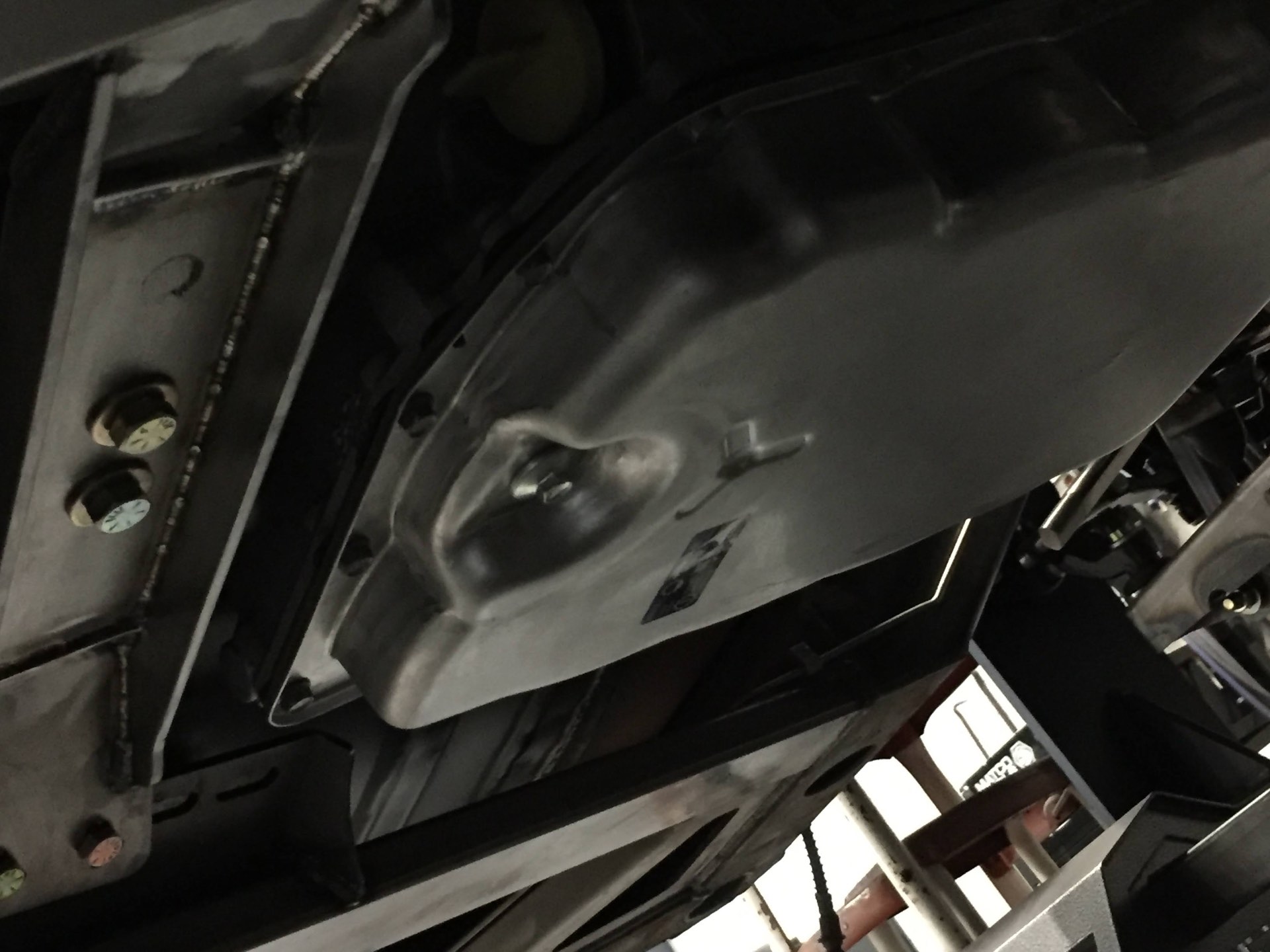 Low-profile Pontiac G8 trans pan to gain proper ground clearance, with the newly fabricated raised transmission mount fully TIG welded.