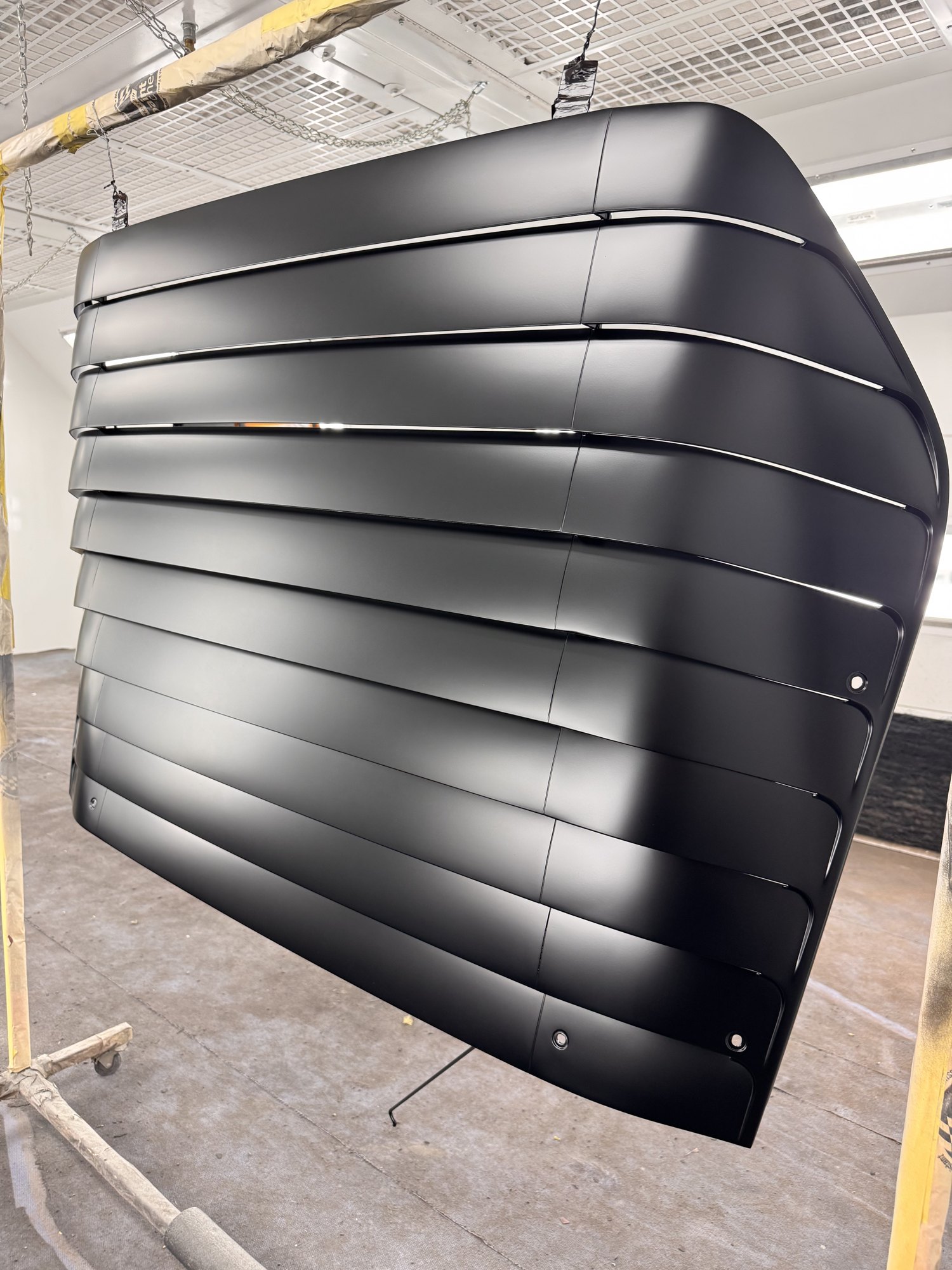 Three-quarter view — original GM slat spacing and crown, straightened and blocked before paint.