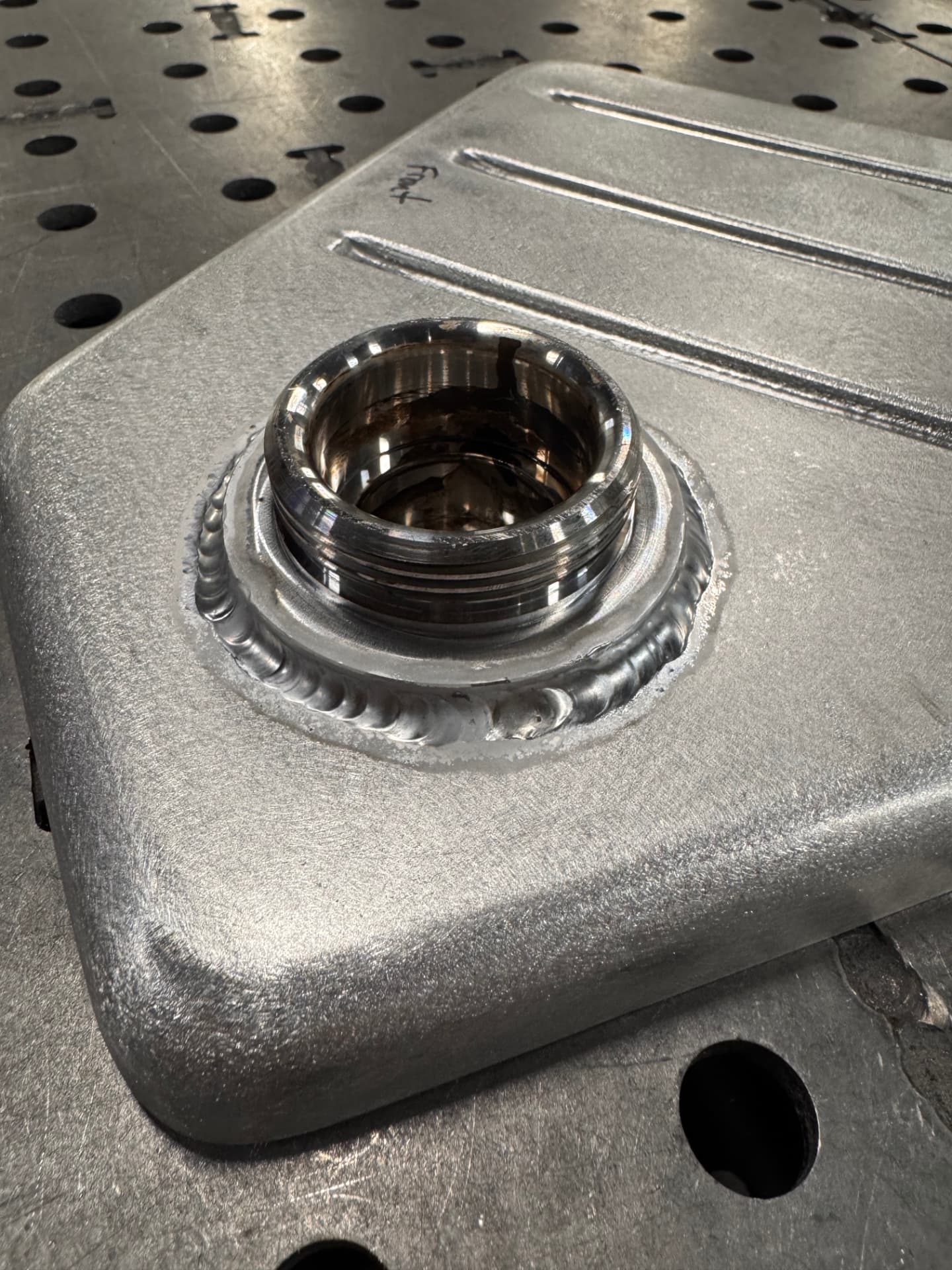 Machined filler neck welded into the top panel.