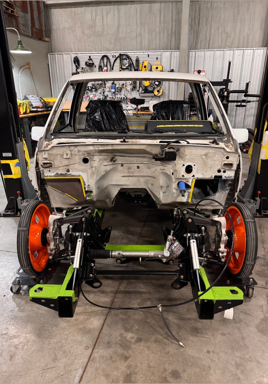 The 454 SS body coming down onto its new chassis, front view.