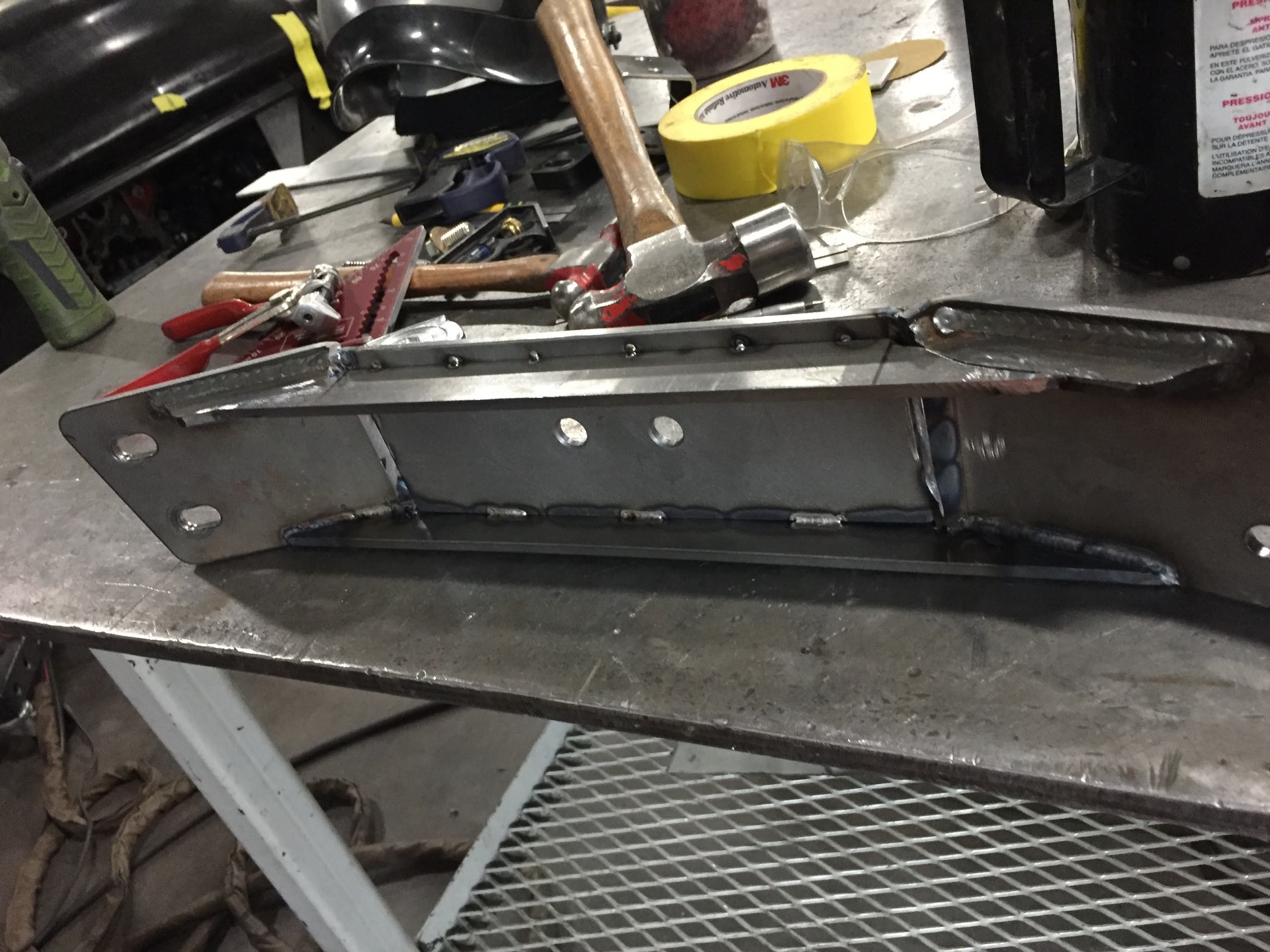 New engine/trans mount fabricated on the bench — welded up before install.