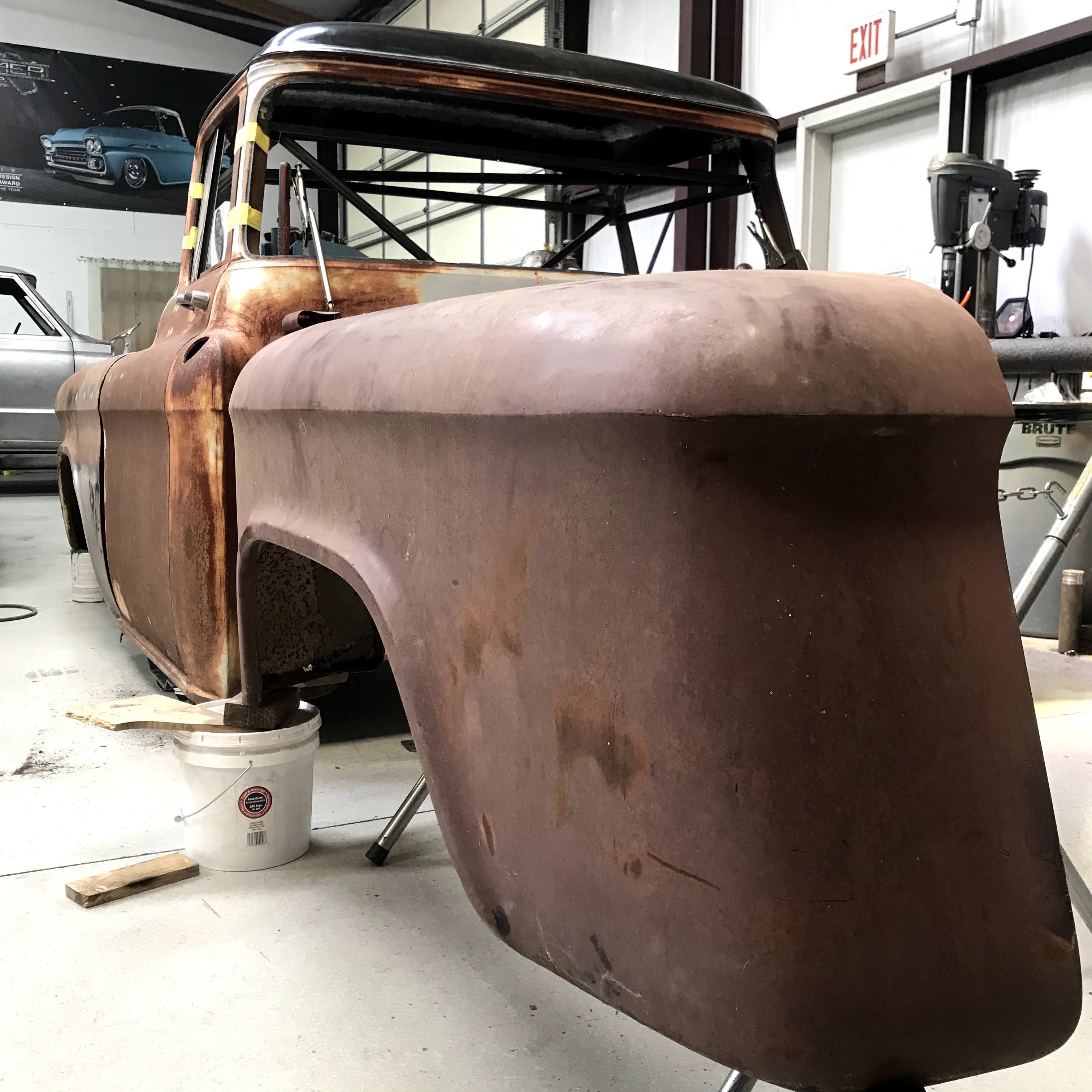 Cab and front fender in bare metal earlier in the body phase.