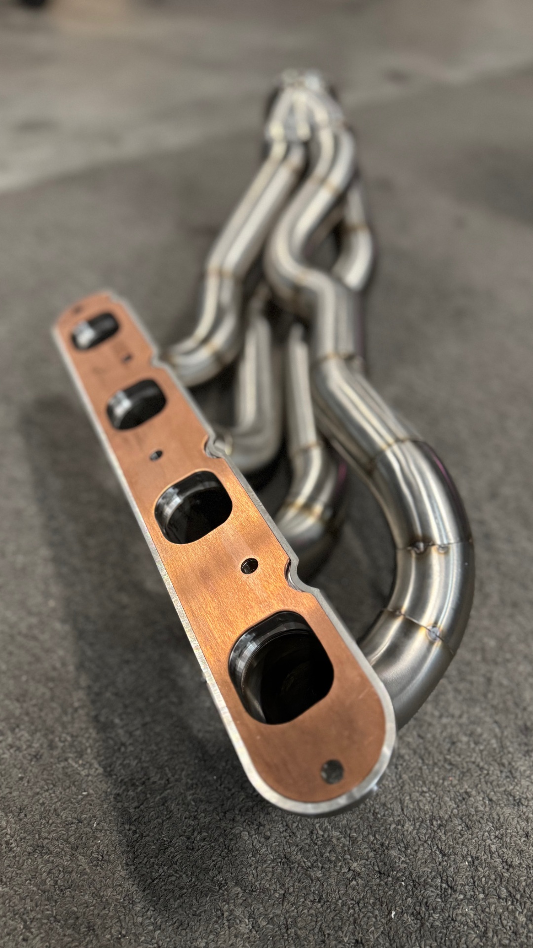 Our 3D machined stainless flange with the integrated copper boost gasket — the stainless bites into the copper as it's torqued down.