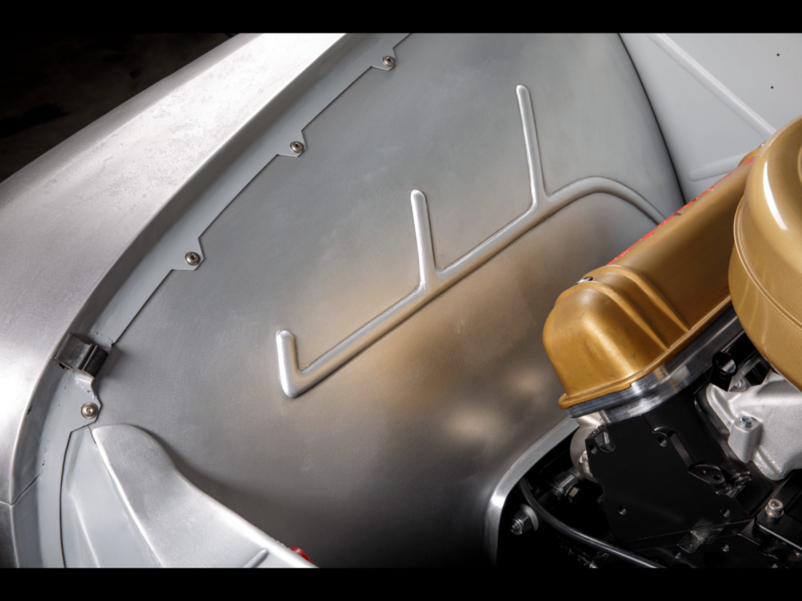 Custom aluminum inner fender and core support cover.