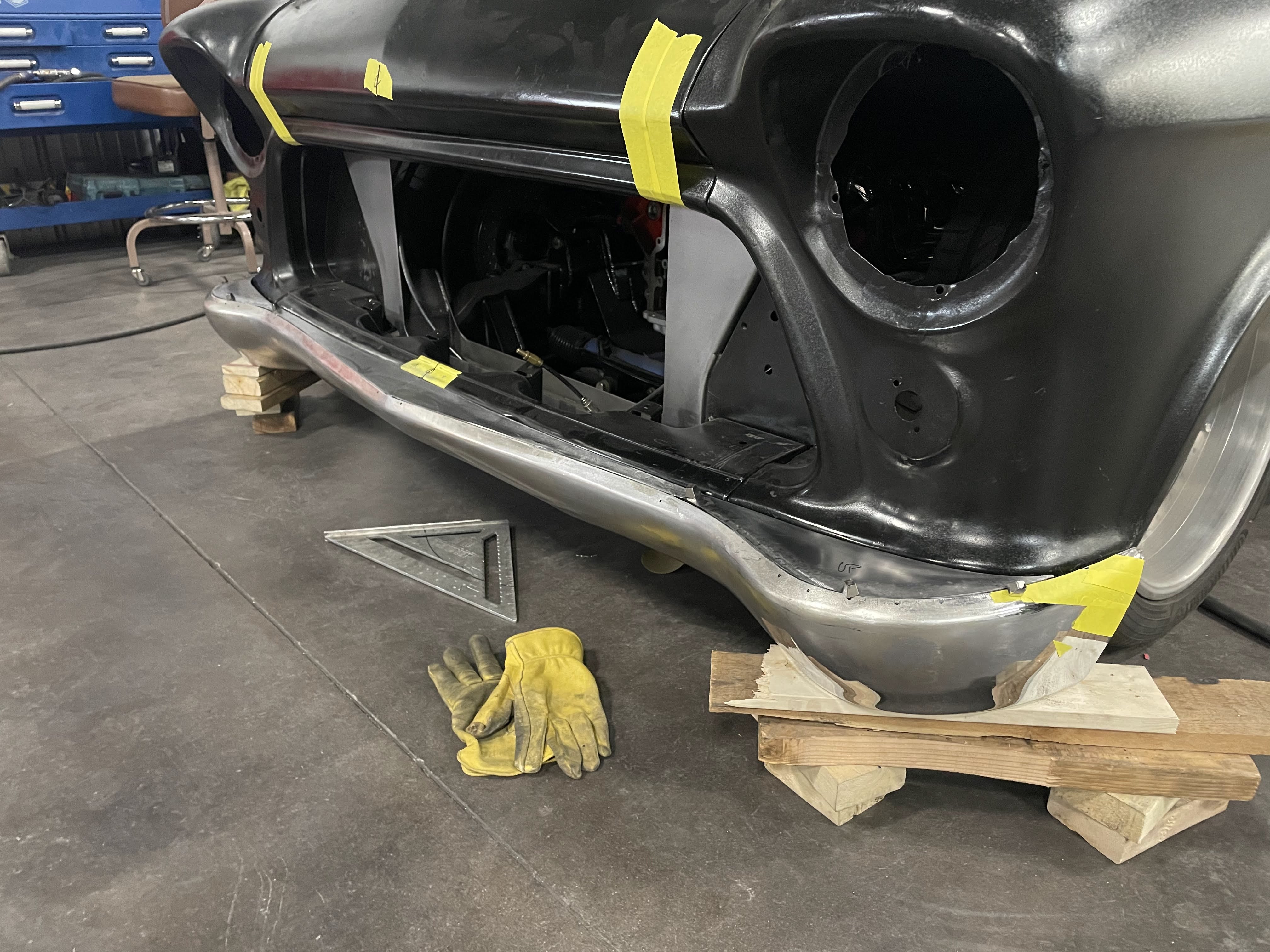 Front clip test-fit — headlight buckets and grille surround mocked in place.