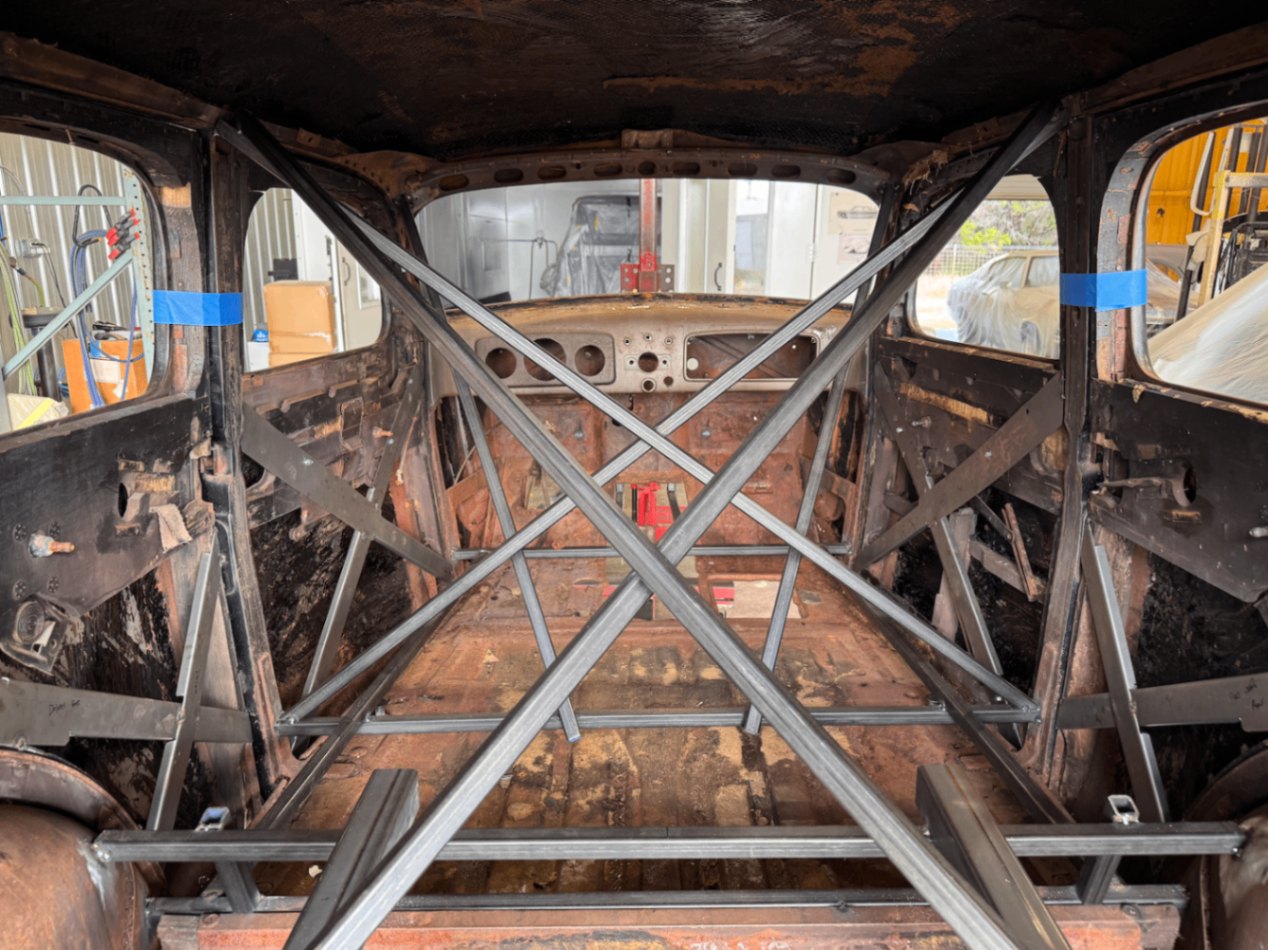 Cross-bracing across the cabin, protecting the wooden inner structure.