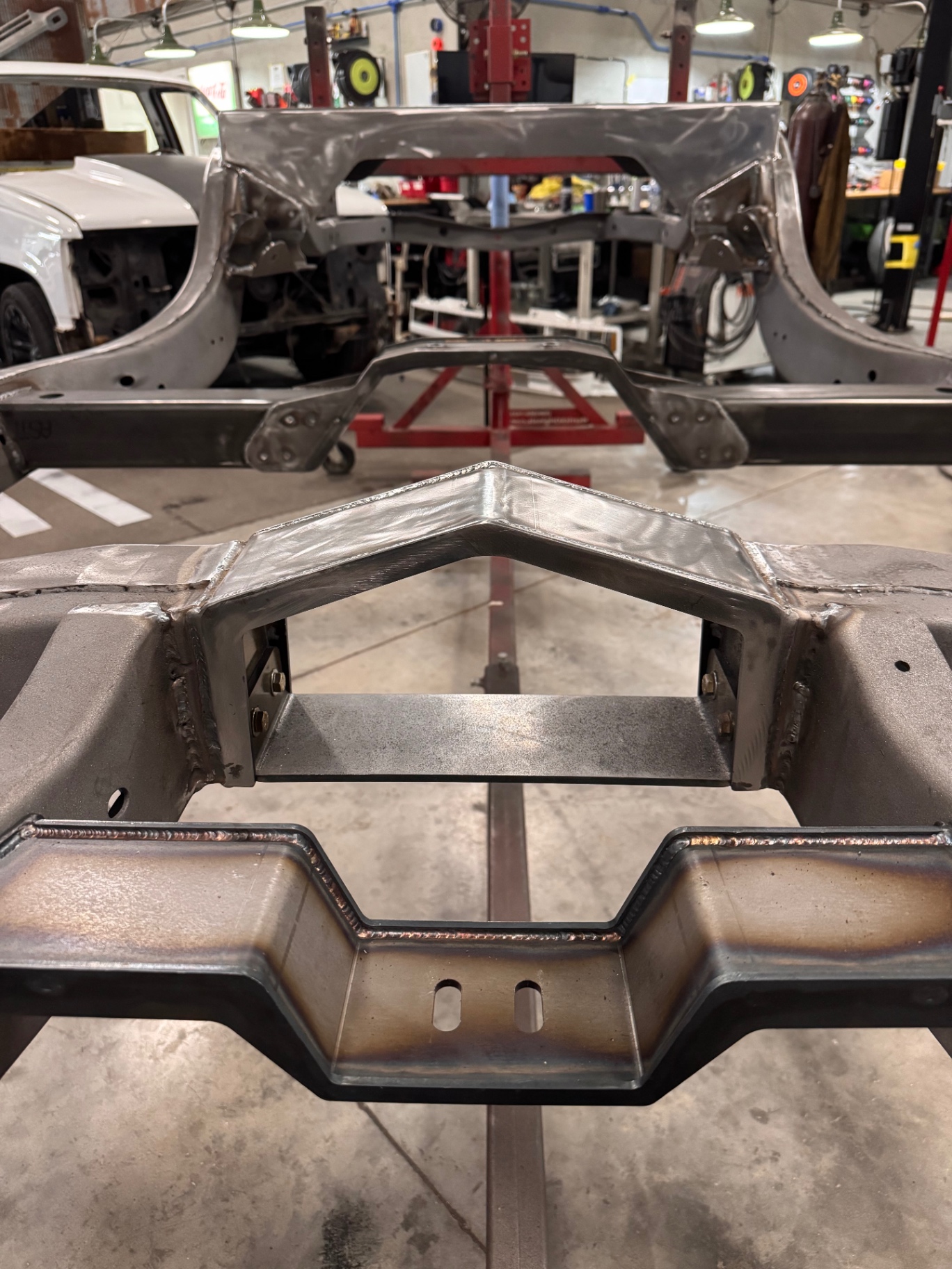 Driveshaft loop and rear crossmember — front and back views