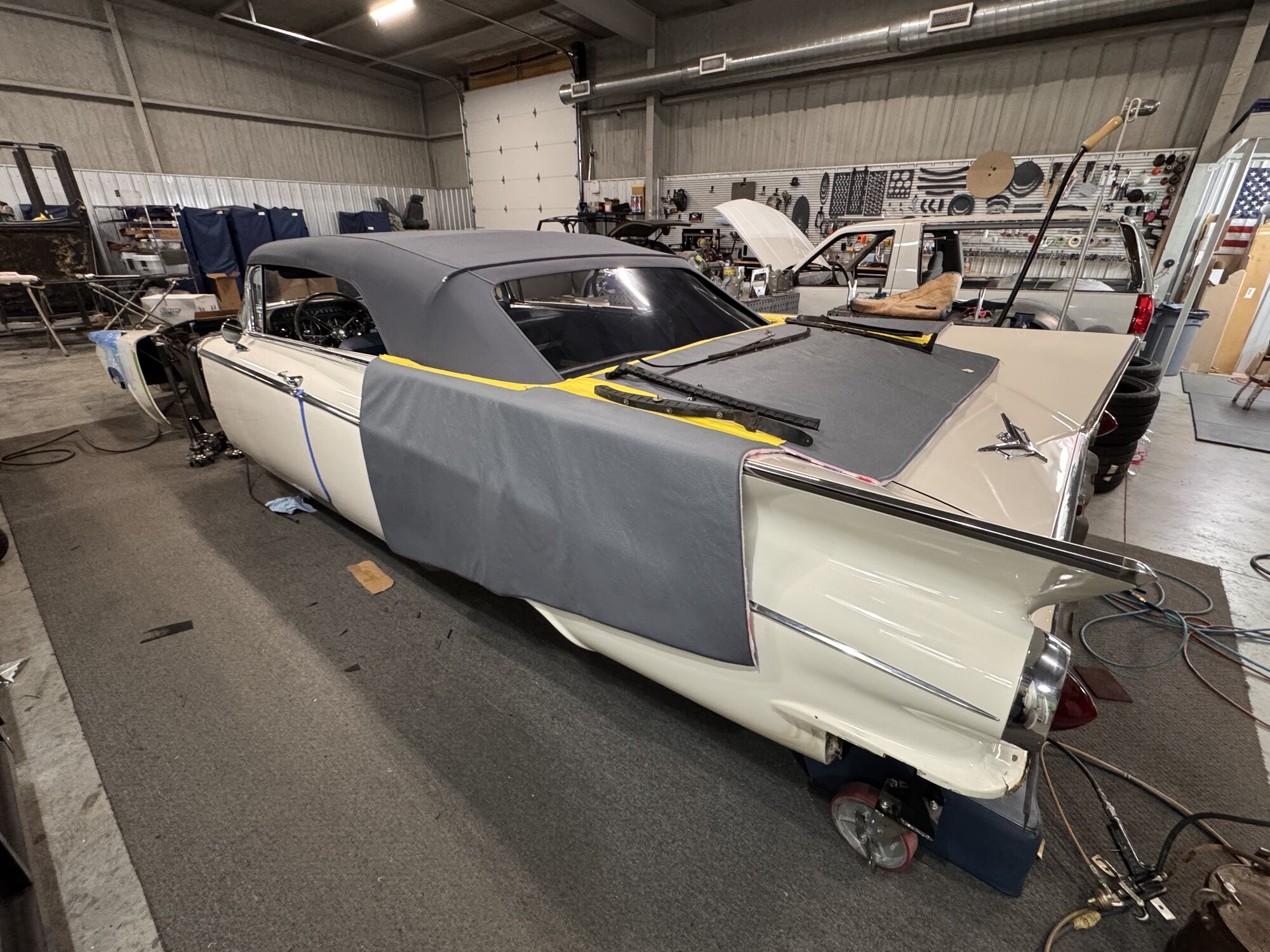 New custom-color canvas top fitted over the '59 — clean lines from the header bow to the rear tack strip