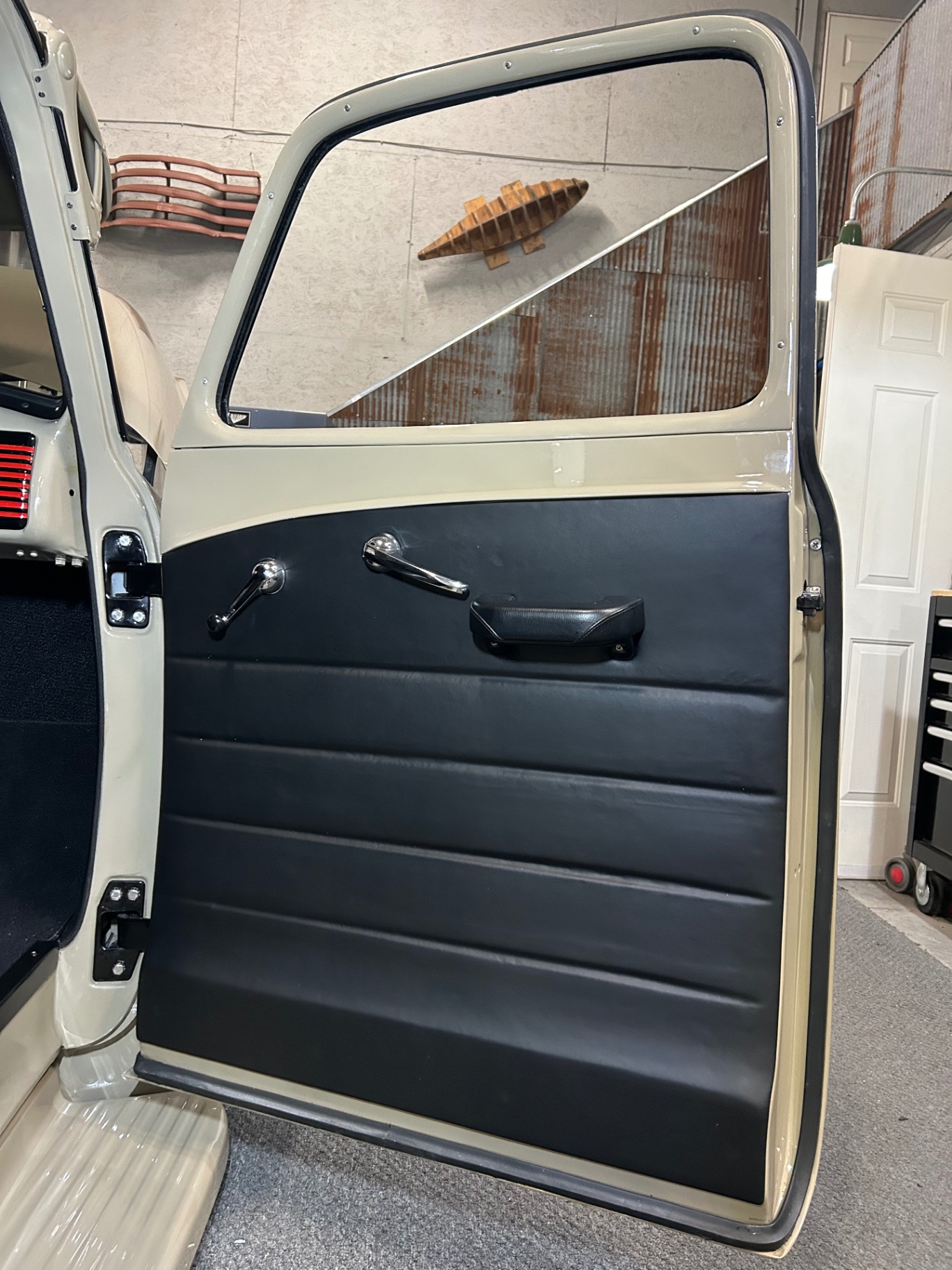 Passenger panel — form-fit lower hugs the door contour, magnets hold it flush.