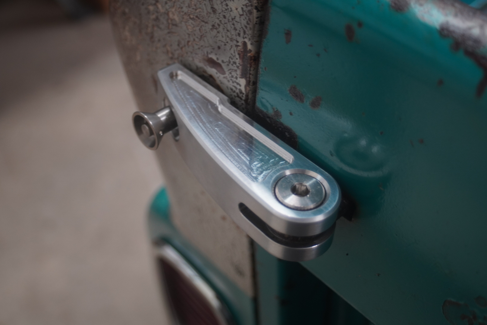 Billet door handle installed on a patina truck