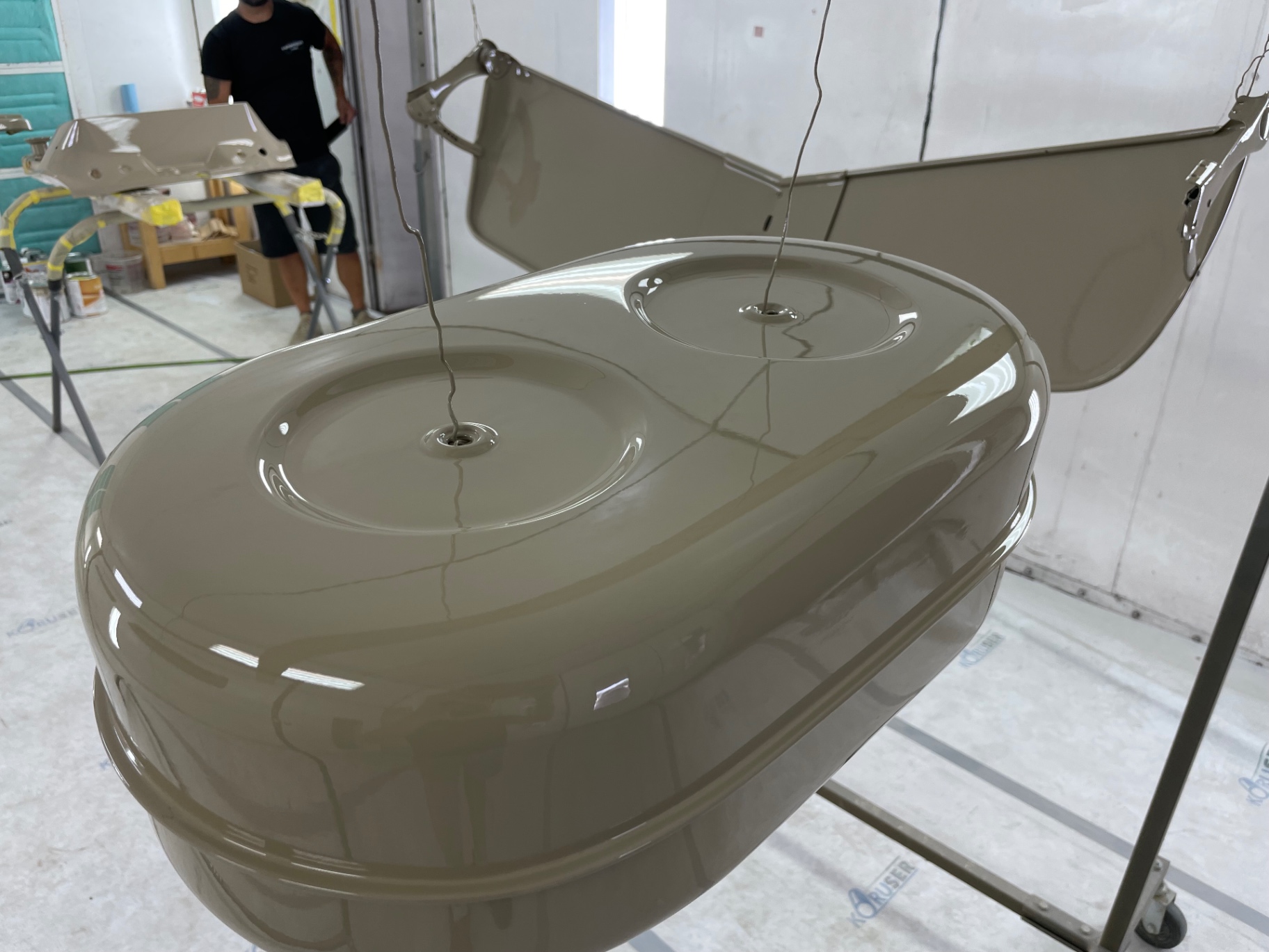Air cleaner top and door skin hung to flash — the color reads warm under the lights.