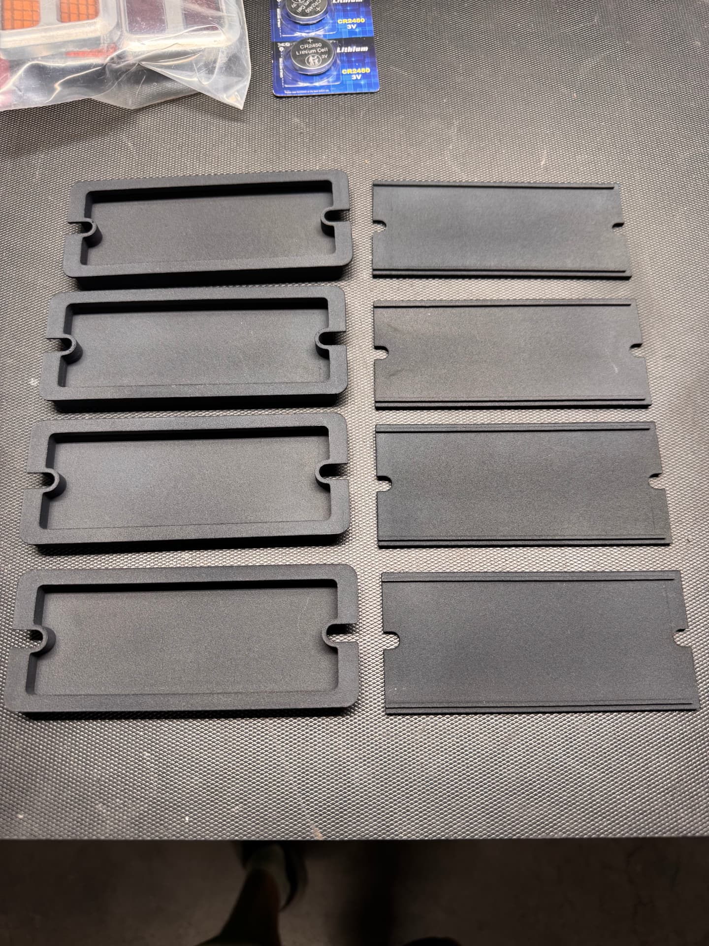 Printed bezels and backing plates ready for lens fitment.