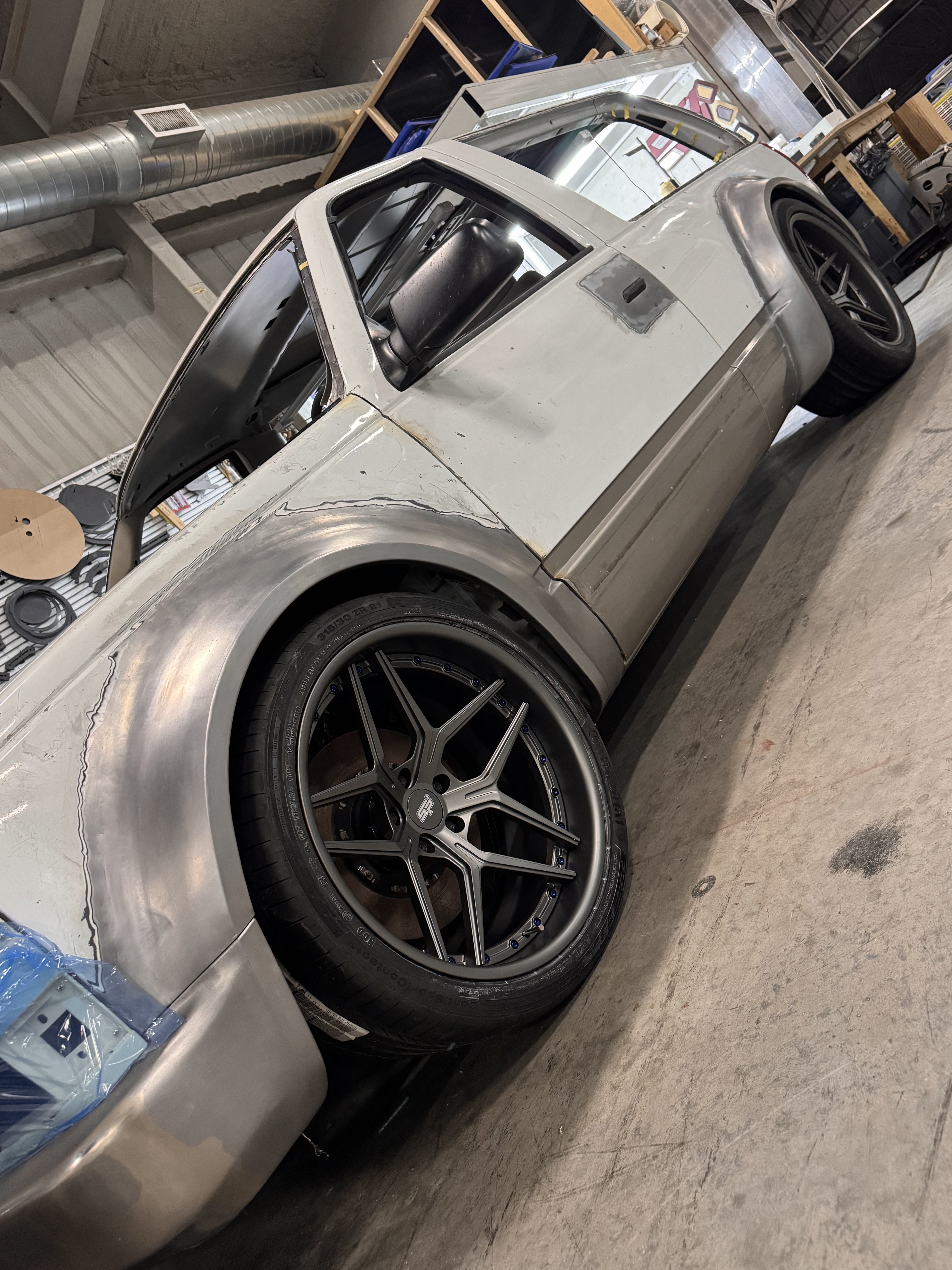 Custom SP2 forged wheel — deep-dish concave face with custom machining.