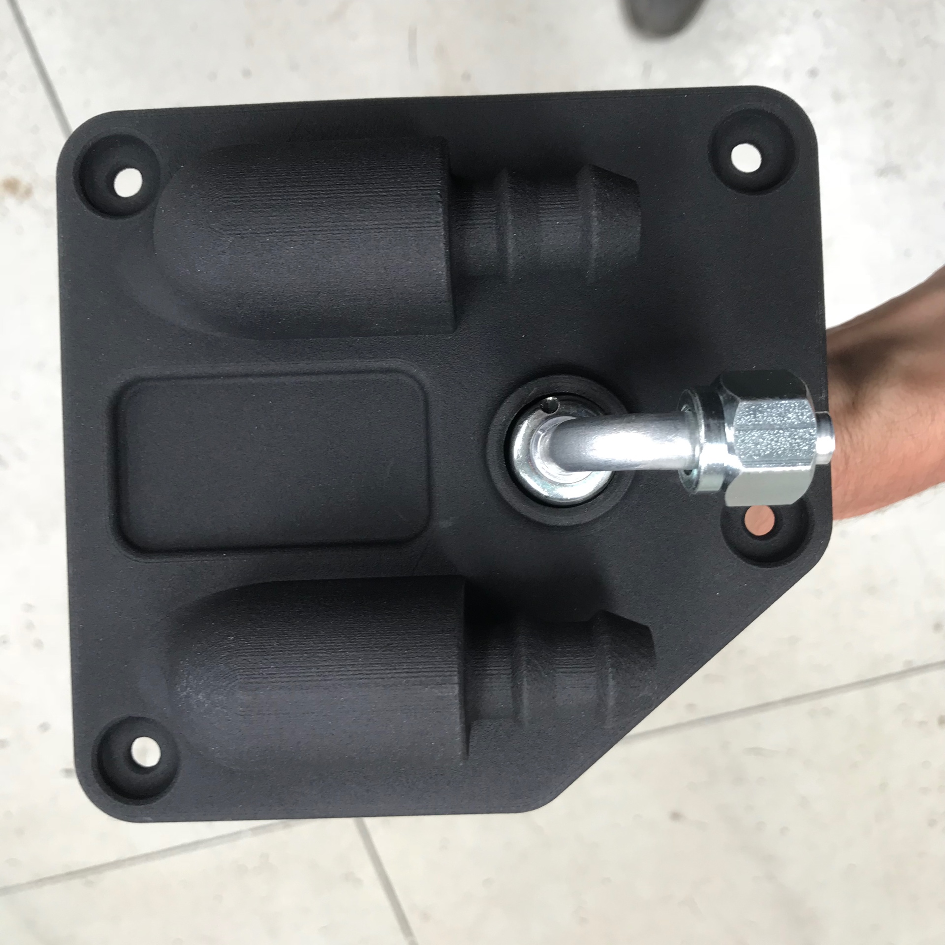 3D-printed heater hose manifold — one of our first functional printed parts, still holding up to hot coolant.
