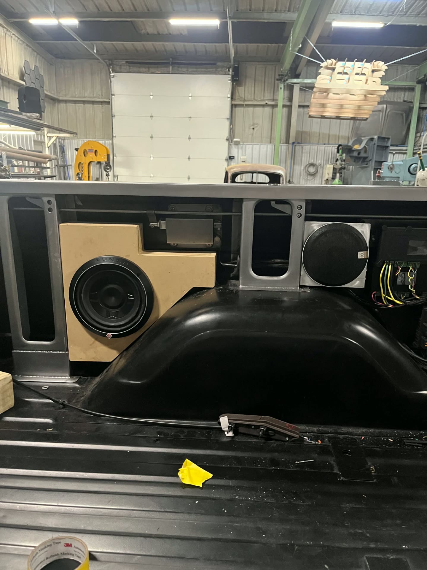 Both sides packaged with speakers and amp behind the panels.
