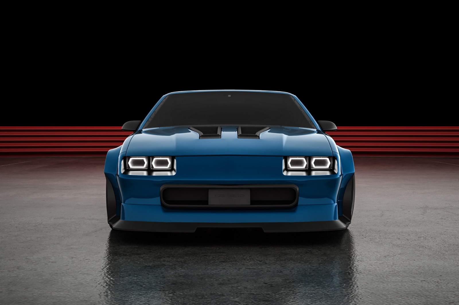 Head-on — quad projector headlights, twin hood vents, and the full width of the flares.