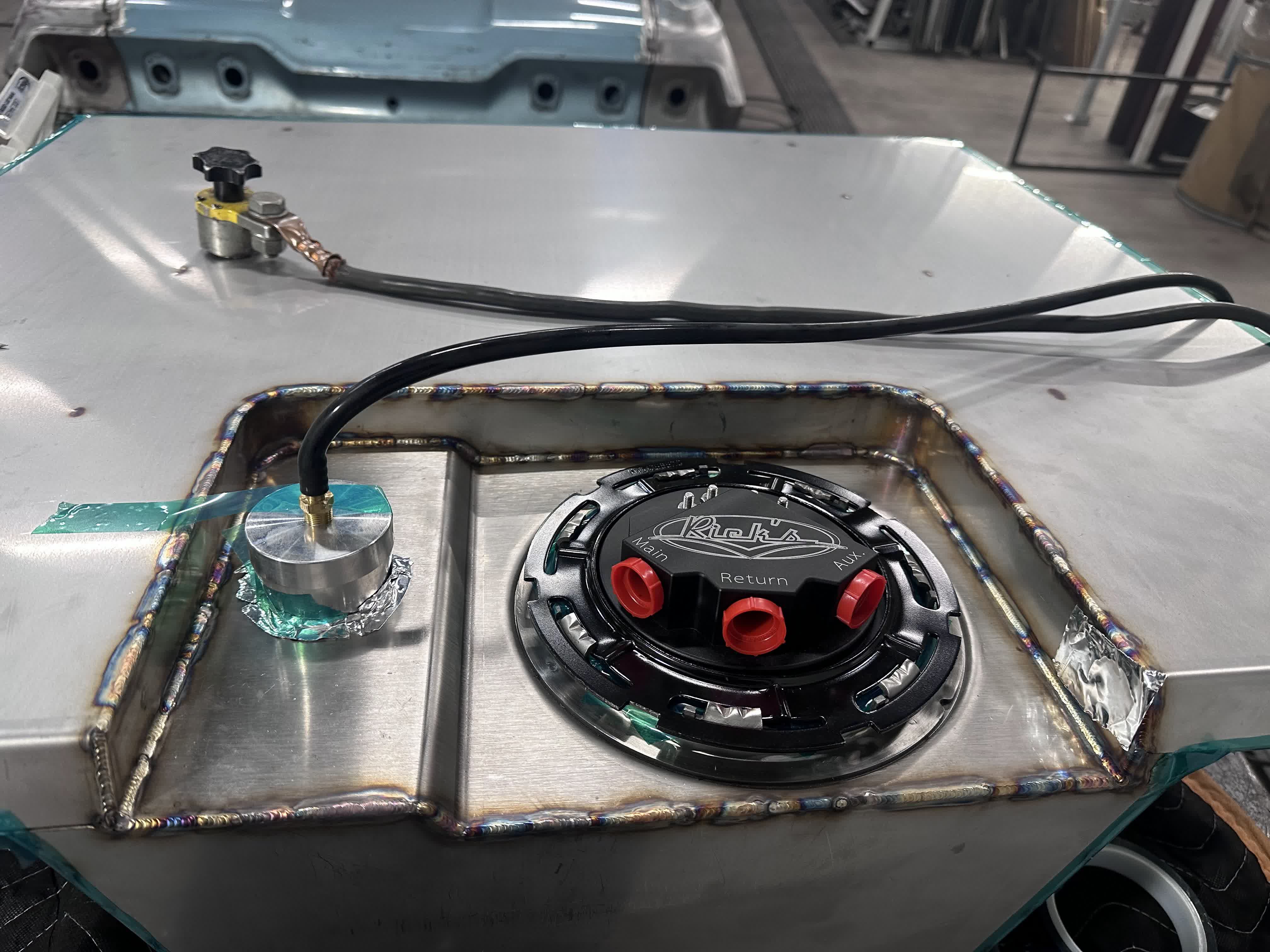 Finished tank with full TIG welds around the recessed sender panel and Rick's Tanks EFI module installed.