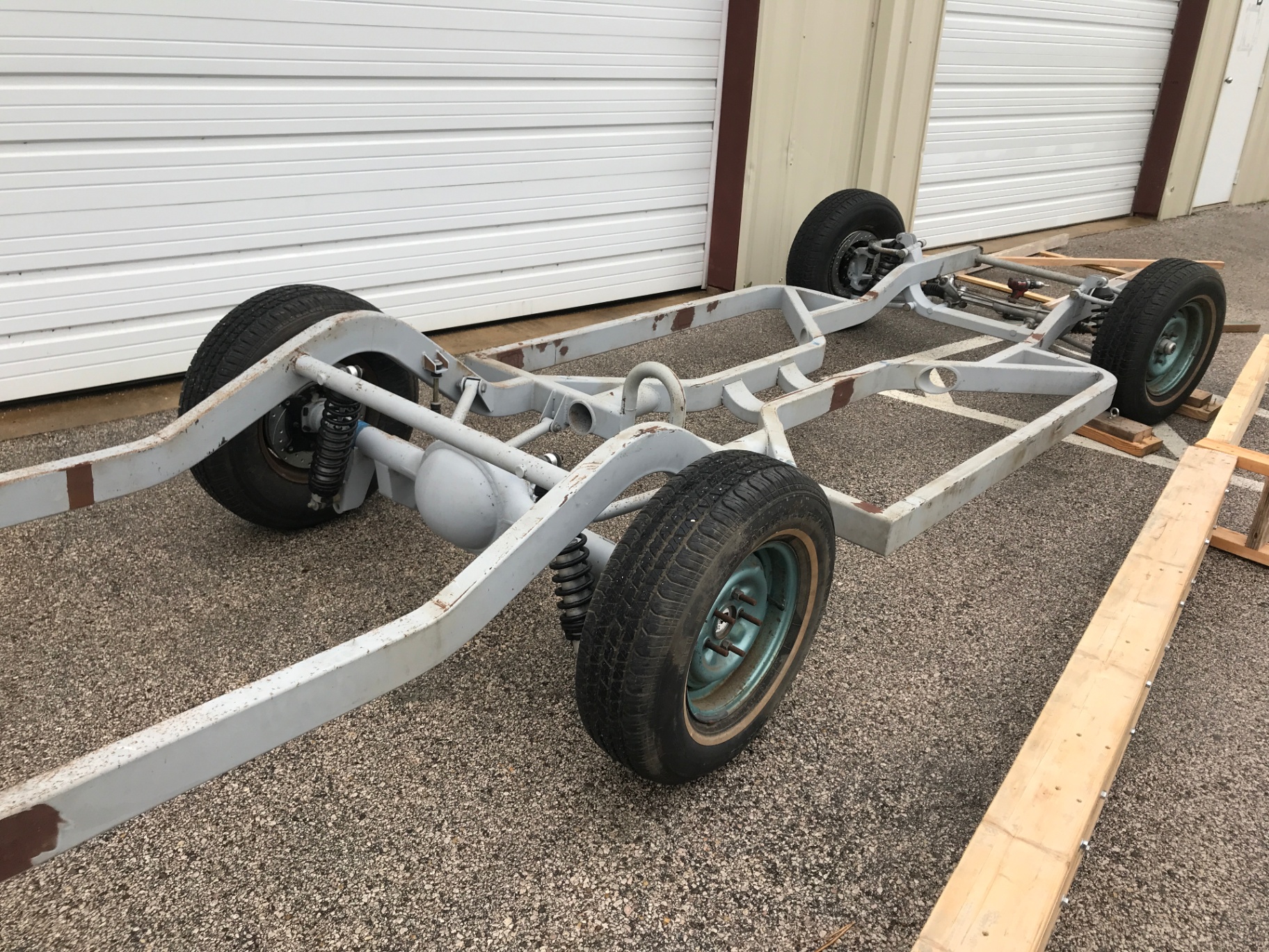 The Impala's original factory frame and suspension after the body came off.