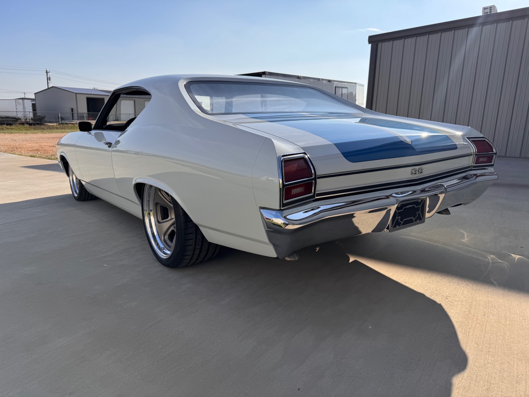Rear three-quarter — SS badge and blue center stripe.