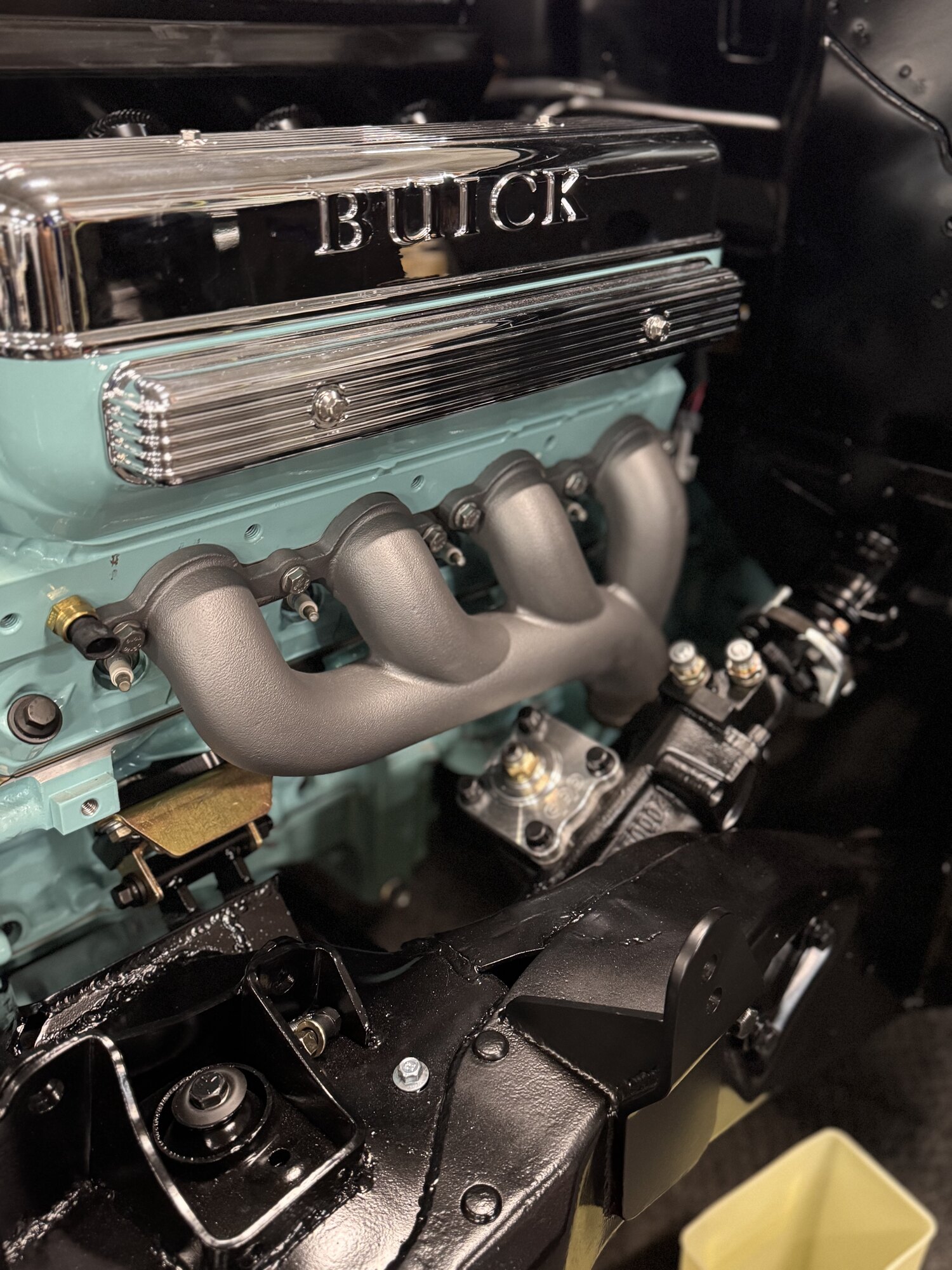 Coated manifold installed against the engine color with the chrome Buick valve covers above